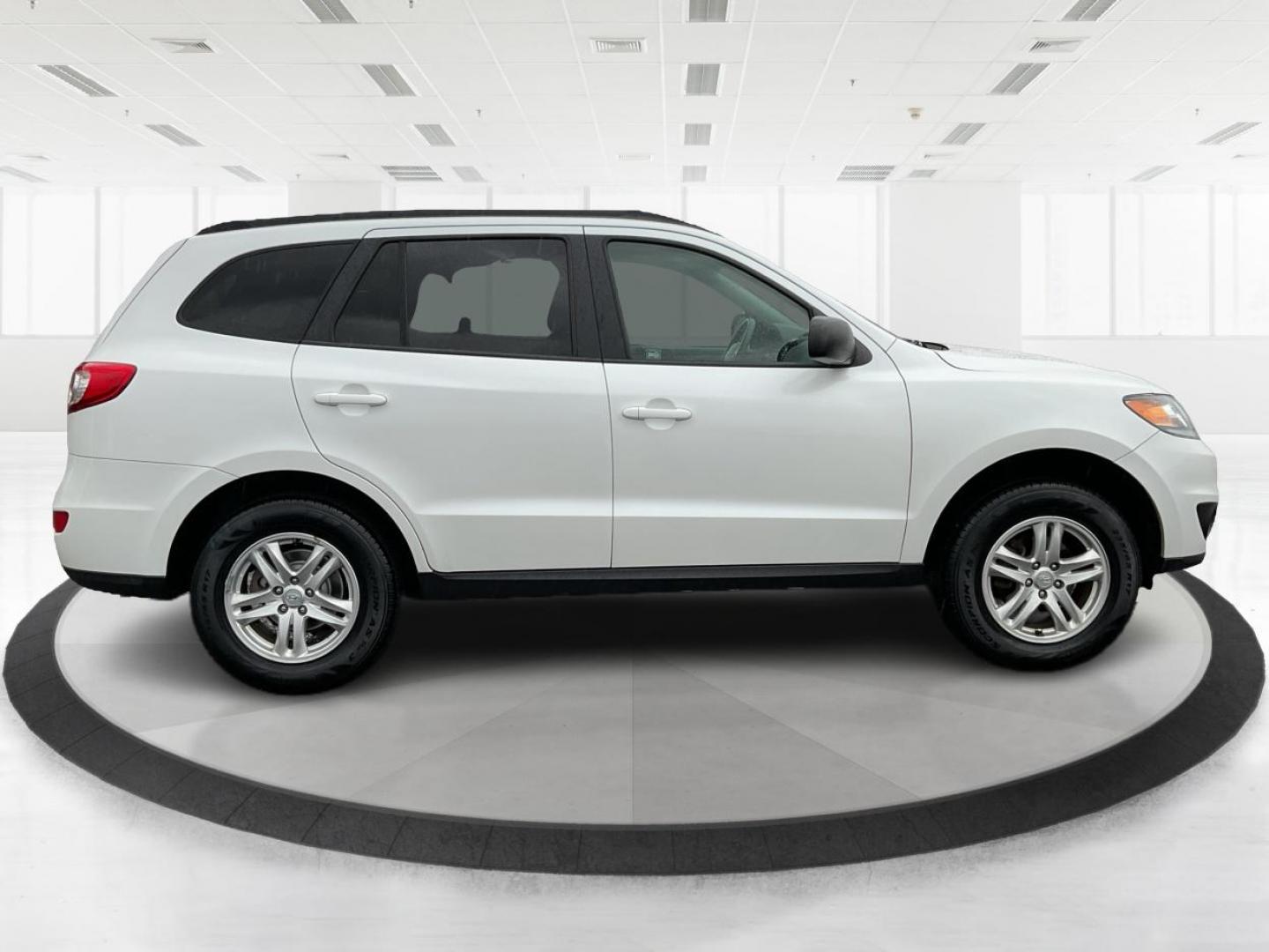 2012 Hyundai Santa Fe GLS (5XYZGDAB5CG) with an 2.4L I-4 DOHC engine, located at 1099 N County Rd 25A , Troy, OH, 45373, (937) 908-9800, 40.057079, -84.212883 - One Owner - Photo#1