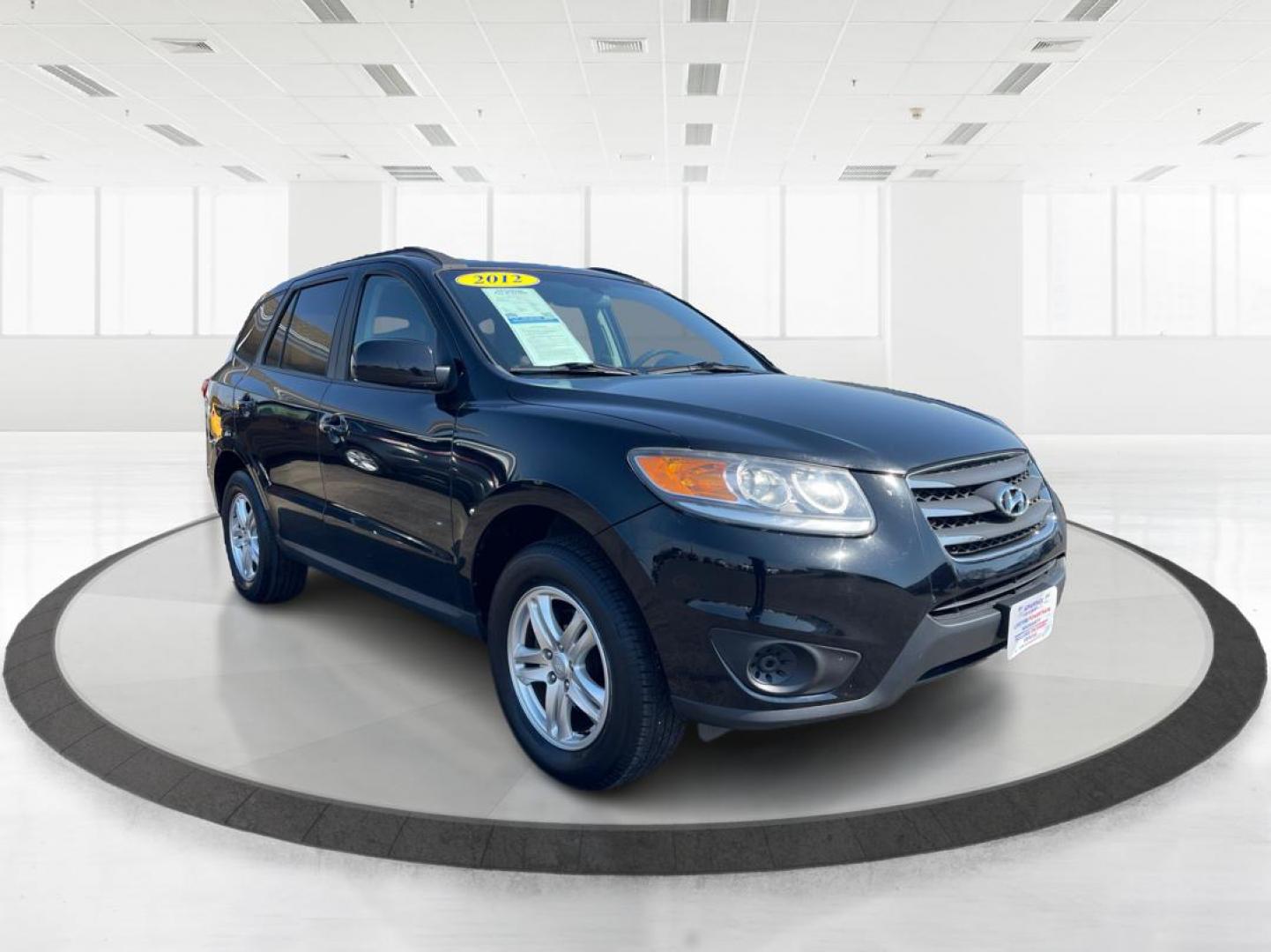 2012 Hyundai Santa Fe GLS (5XYZG3ABXCG) with an 2.4L I-4 DOHC engine, located at 401 Woodman Dr, Riverside, OH, 45431, (937) 908-9800, 39.760899, -84.123421 - 2012 Hyundai Santa Fe GLS - Photo#0