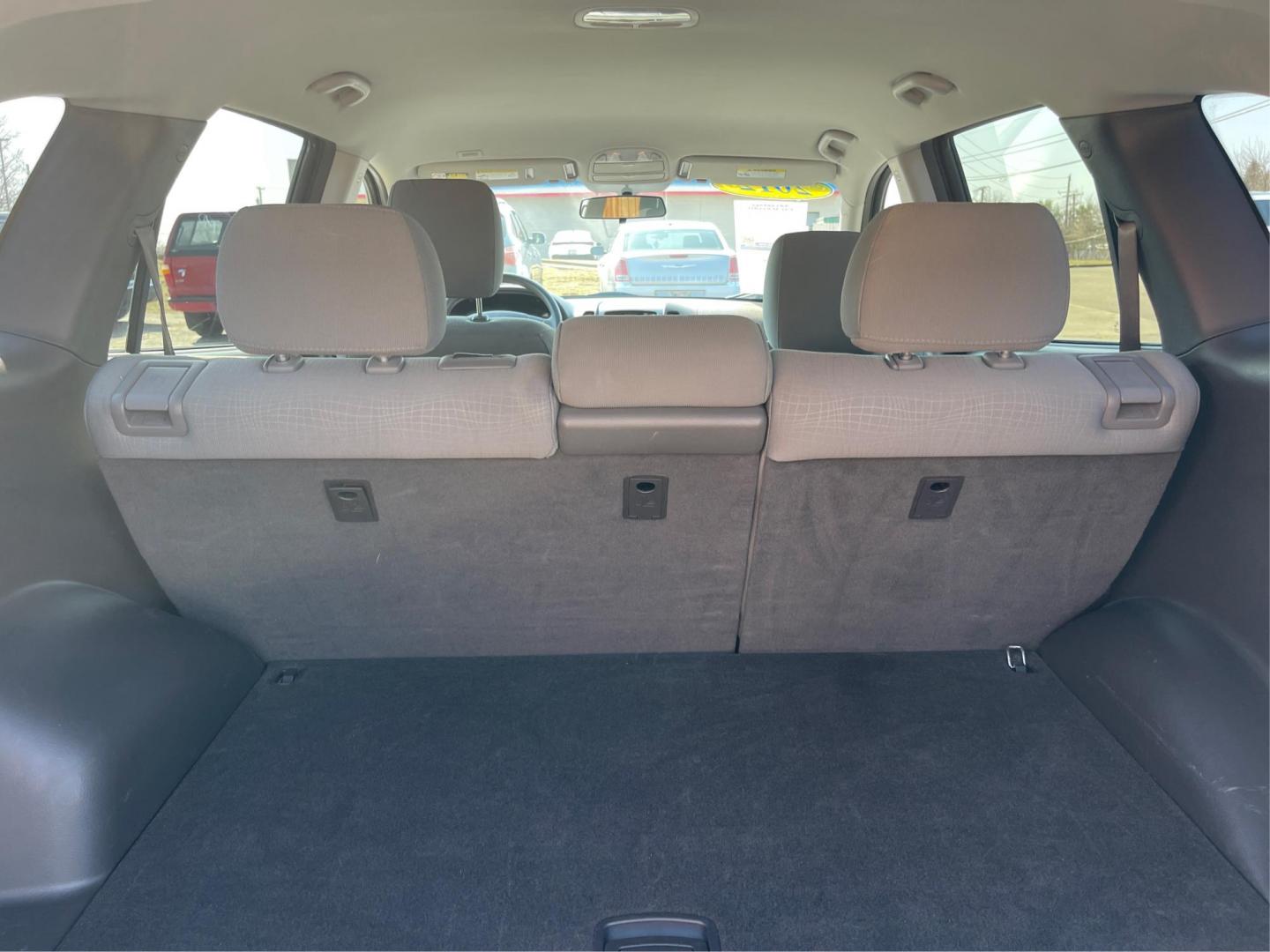 2012 Hyundai Santa Fe GLS (5XYZG3ABXCG) with an 2.4L I-4 DOHC engine, located at 401 Woodman Dr, Riverside, OH, 45431, (937) 908-9800, 39.760899, -84.123421 - 2012 Hyundai Santa Fe GLS - Photo#10