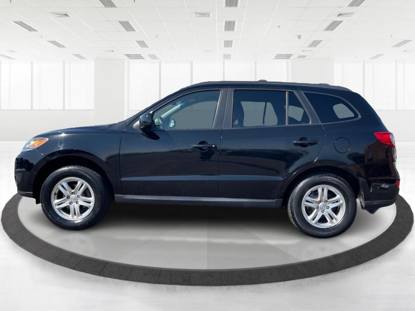 2012 Hyundai Santa Fe GLS (5XYZG3ABXCG) with an 2.4L I-4 DOHC engine, located at 401 Woodman Dr, Riverside, OH, 45431, (937) 908-9800, 39.760899, -84.123421 - 2012 Hyundai Santa Fe GLS - Photo#5
