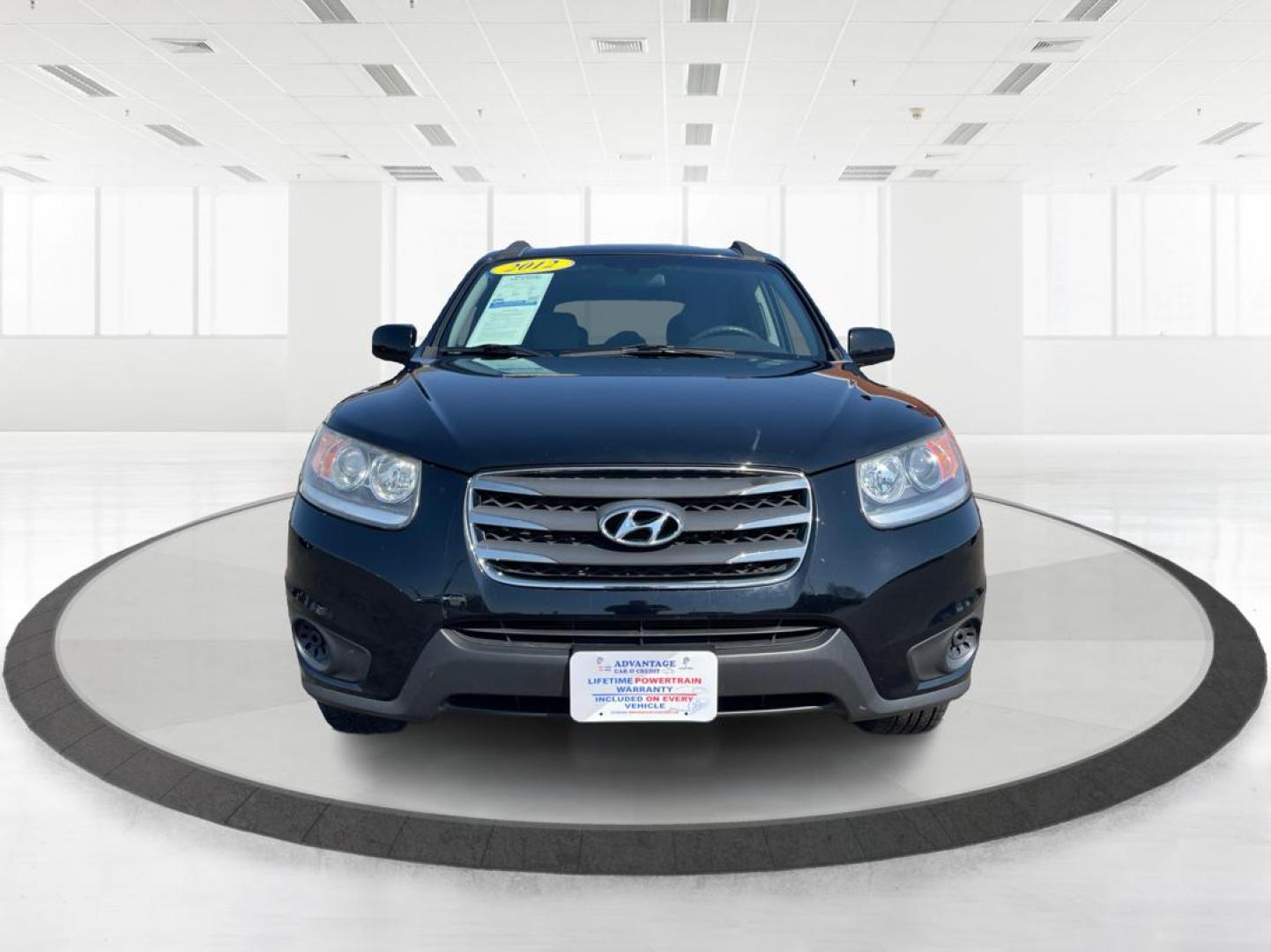 2012 Hyundai Santa Fe GLS (5XYZG3ABXCG) with an 2.4L I-4 DOHC engine, located at 401 Woodman Dr, Riverside, OH, 45431, (937) 908-9800, 39.760899, -84.123421 - 2012 Hyundai Santa Fe GLS - Photo#6