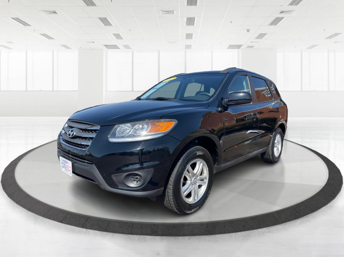 2012 Hyundai Santa Fe GLS (5XYZG3ABXCG) with an 2.4L I-4 DOHC engine, located at 401 Woodman Dr, Riverside, OH, 45431, (937) 908-9800, 39.760899, -84.123421 - 2012 Hyundai Santa Fe GLS - Photo#7