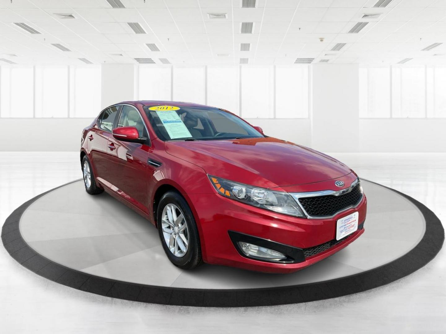 2012 Spicy Red Metallic Kia Optima LX AT (5XXGM4A73CG) with an 2.4L L4 DOHC 16V engine, 6-Speed Automatic transmission, located at 1099 N County Rd 25A , Troy, OH, 45373, (937) 908-9800, 40.057079, -84.212883 - 2012 Kia Optima LX AT - Photo#0