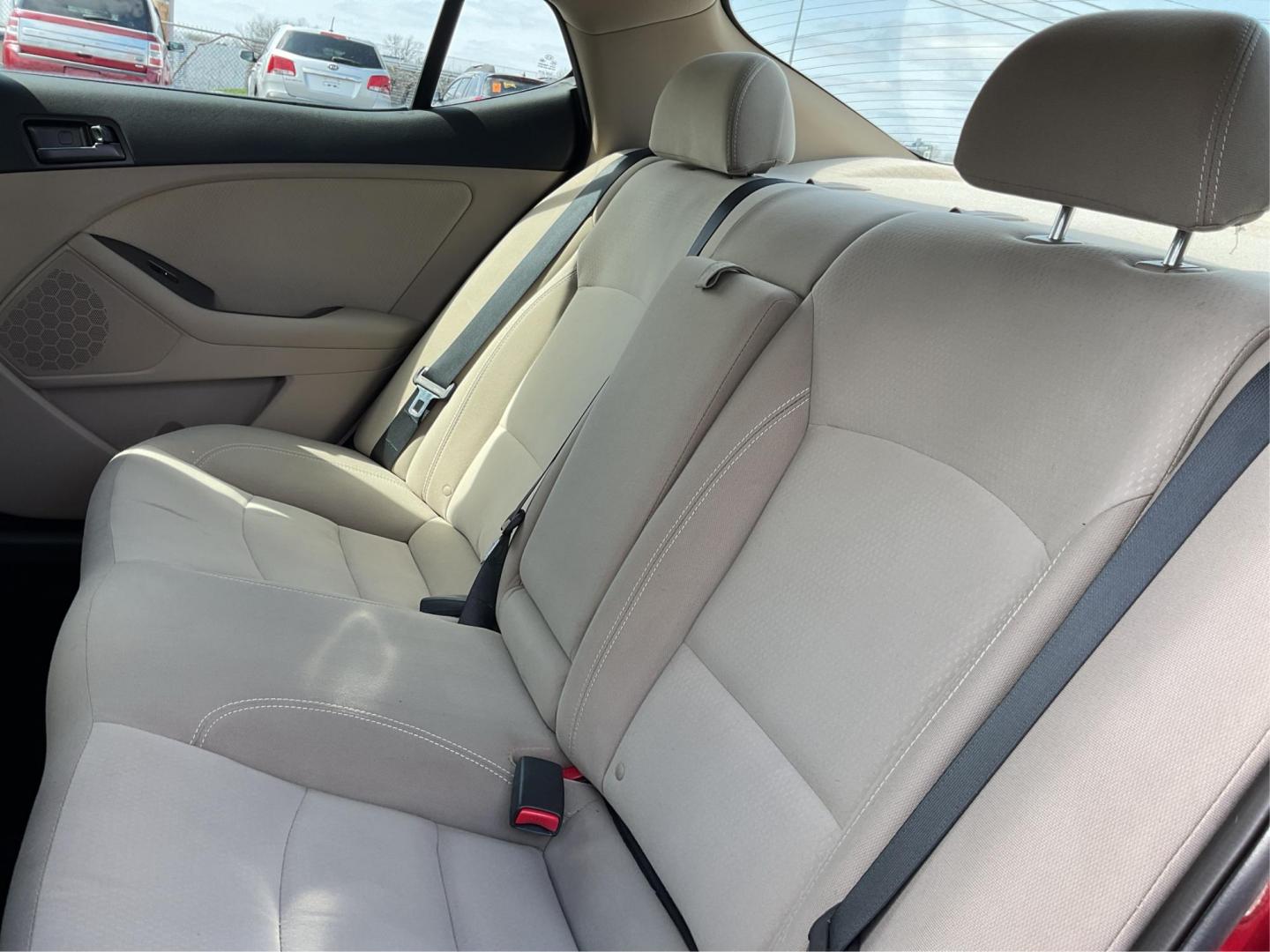 2012 Spicy Red Metallic Kia Optima LX AT (5XXGM4A73CG) with an 2.4L L4 DOHC 16V engine, 6-Speed Automatic transmission, located at 1099 N County Rd 25A , Troy, OH, 45373, (937) 908-9800, 40.057079, -84.212883 - 2012 Kia Optima LX AT - Photo#9