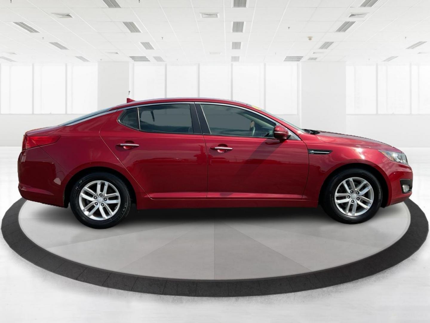 2012 Spicy Red Metallic Kia Optima LX AT (5XXGM4A73CG) with an 2.4L L4 DOHC 16V engine, 6-Speed Automatic transmission, located at 1099 N County Rd 25A , Troy, OH, 45373, (937) 908-9800, 40.057079, -84.212883 - 2012 Kia Optima LX AT - Photo#1