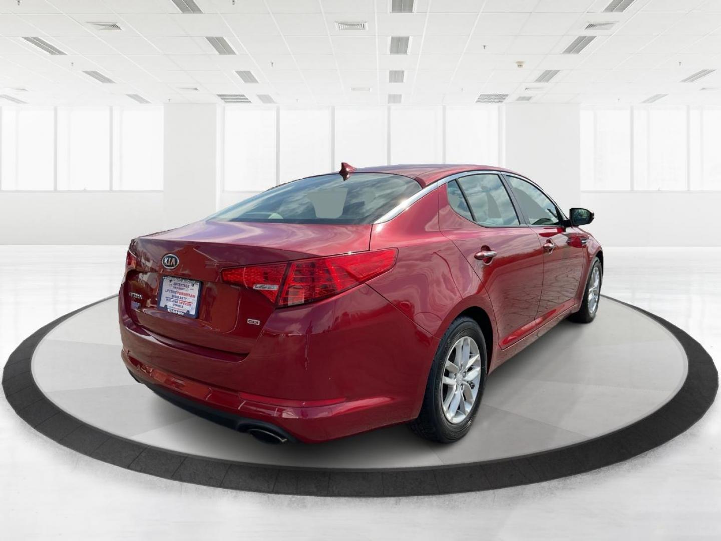 2012 Spicy Red Metallic Kia Optima LX AT (5XXGM4A73CG) with an 2.4L L4 DOHC 16V engine, 6-Speed Automatic transmission, located at 1099 N County Rd 25A , Troy, OH, 45373, (937) 908-9800, 40.057079, -84.212883 - 2012 Kia Optima LX AT - Photo#2