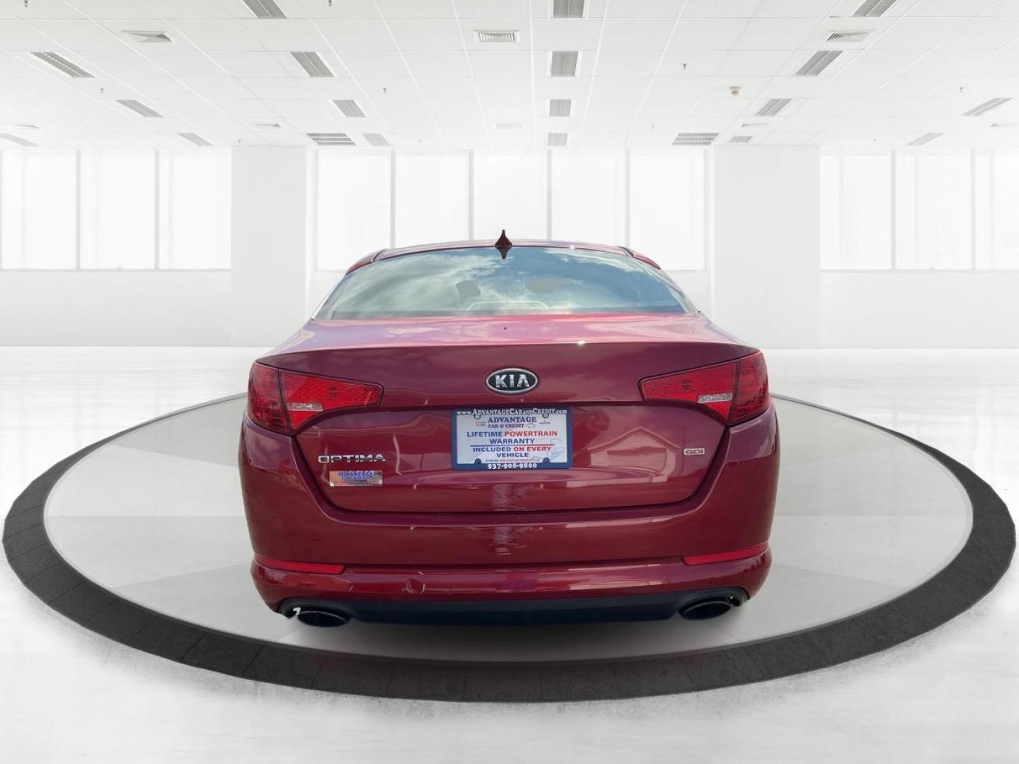 2012 Spicy Red Metallic Kia Optima LX AT (5XXGM4A73CG) with an 2.4L L4 DOHC 16V engine, 6-Speed Automatic transmission, located at 1099 N County Rd 25A , Troy, OH, 45373, (937) 908-9800, 40.057079, -84.212883 - 2012 Kia Optima LX AT - Photo#3