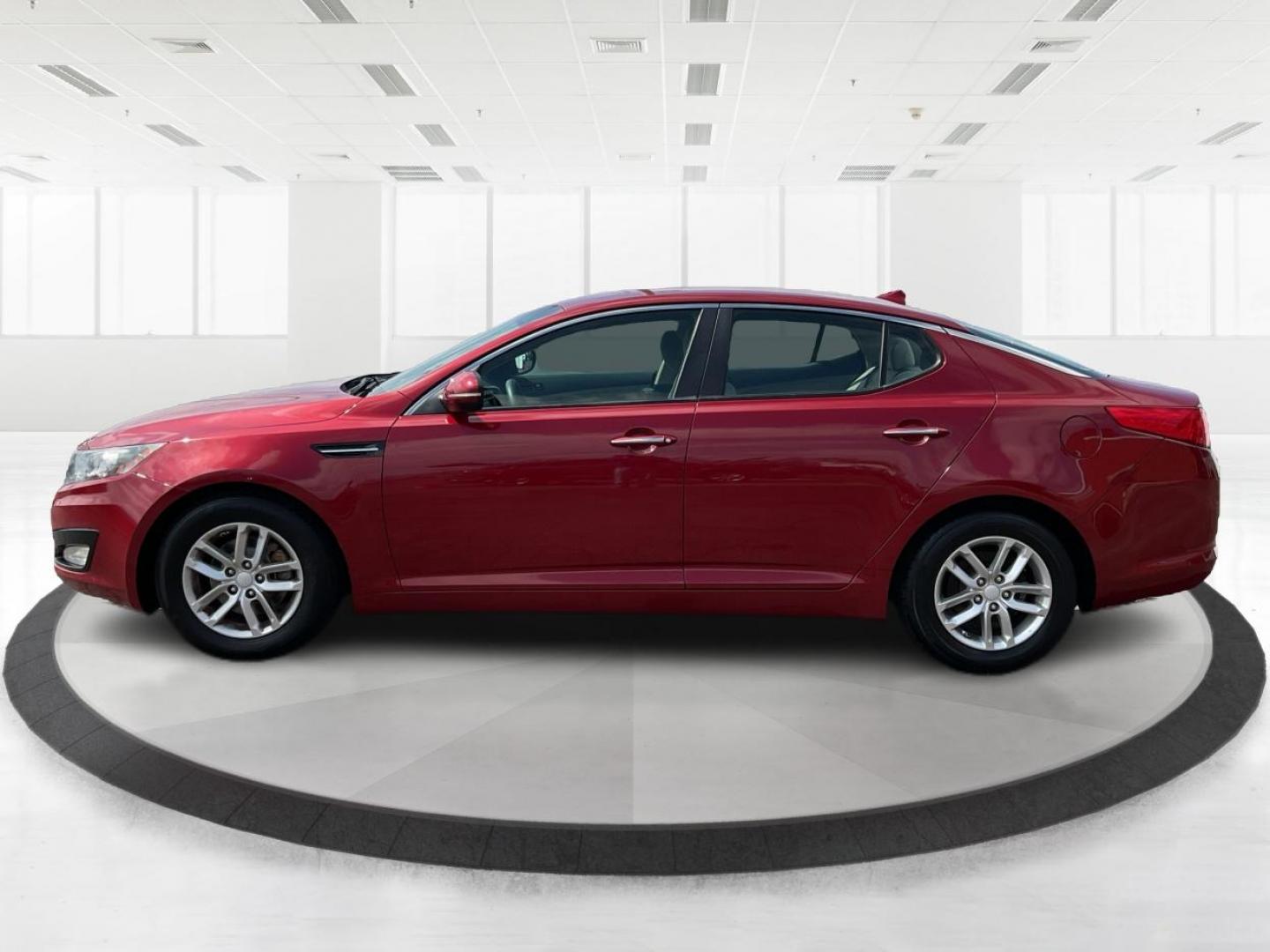 2012 Spicy Red Metallic Kia Optima LX AT (5XXGM4A73CG) with an 2.4L L4 DOHC 16V engine, 6-Speed Automatic transmission, located at 1099 N County Rd 25A , Troy, OH, 45373, (937) 908-9800, 40.057079, -84.212883 - 2012 Kia Optima LX AT - Photo#5
