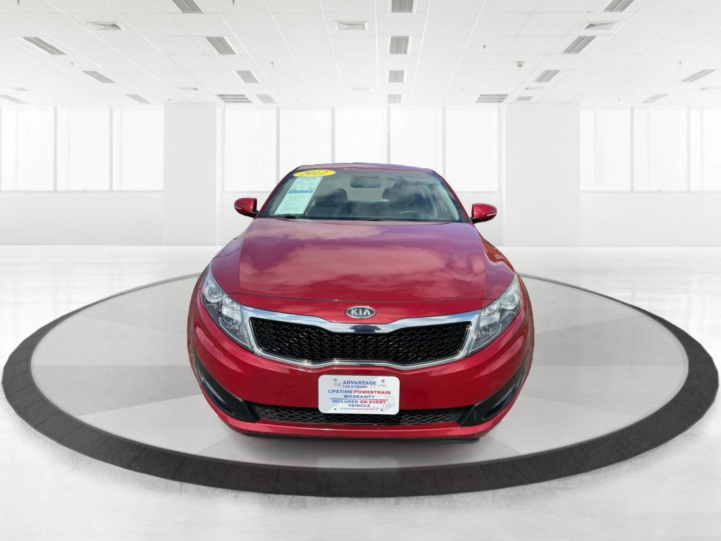 2012 Spicy Red Metallic Kia Optima LX AT (5XXGM4A73CG) with an 2.4L L4 DOHC 16V engine, 6-Speed Automatic transmission, located at 1099 N County Rd 25A , Troy, OH, 45373, (937) 908-9800, 40.057079, -84.212883 - 2012 Kia Optima LX AT - Photo#6