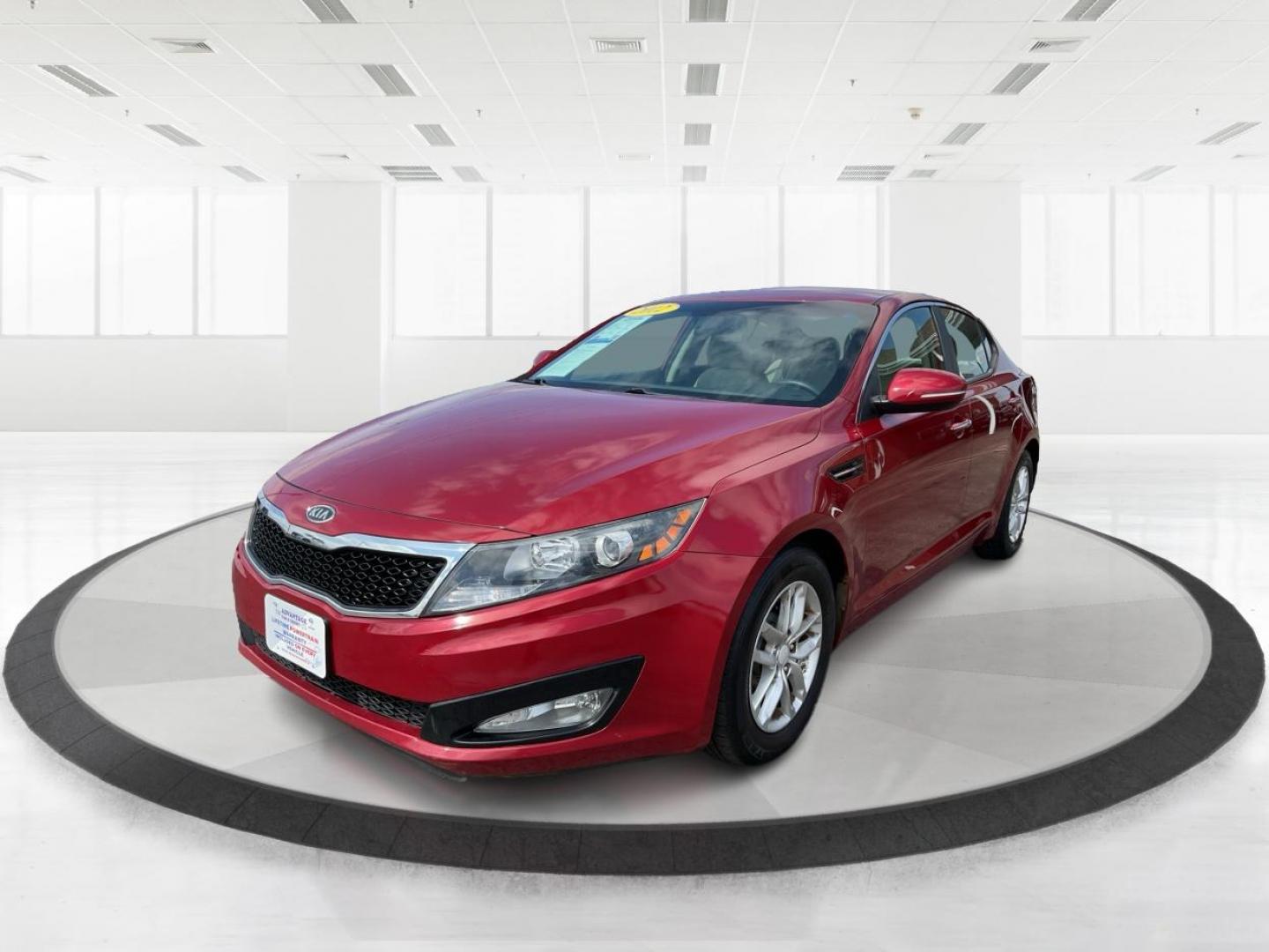 2012 Spicy Red Metallic Kia Optima LX AT (5XXGM4A73CG) with an 2.4L L4 DOHC 16V engine, 6-Speed Automatic transmission, located at 1099 N County Rd 25A , Troy, OH, 45373, (937) 908-9800, 40.057079, -84.212883 - 2012 Kia Optima LX AT - Photo#7