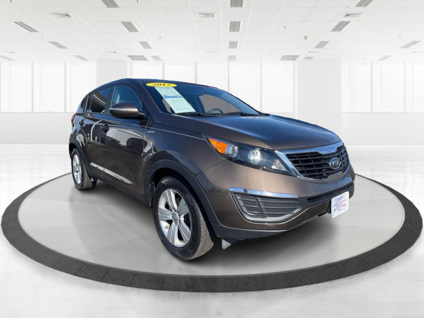 2012 Kia Sportage LX (KNDPBCA20C7) with an 2.4L I-4 DOHC engine, located at 401 Woodman Dr, Riverside, OH, 45431, (937) 908-9800, 39.760899, -84.123421 - 2012 Kia Sportage LX - Photo#0