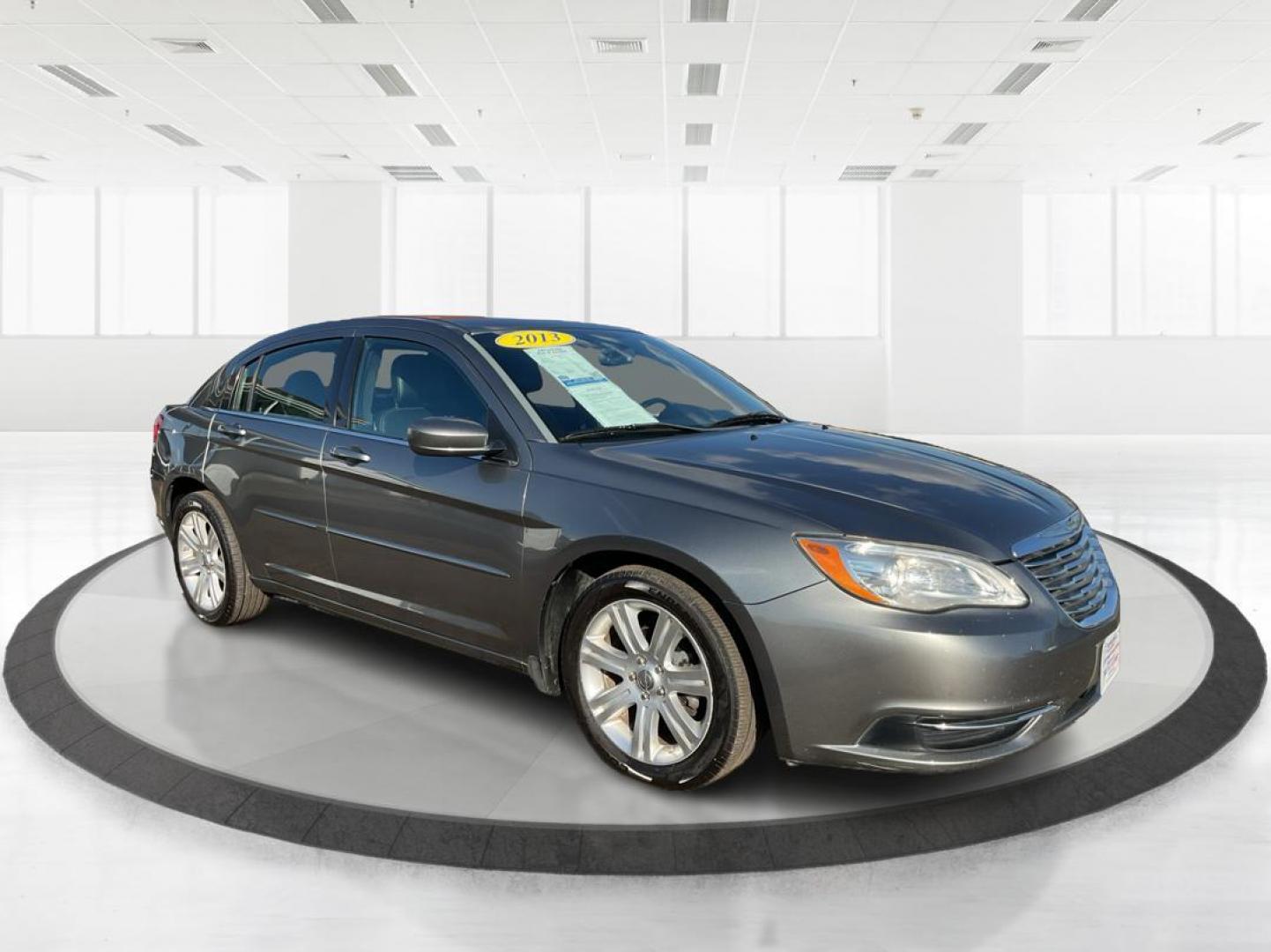2013 Chrysler 200 Touring (1C3CCBBG0DN) with an 2.4L I-4 DOHC engine, located at 401 Woodman Dr, Riverside, OH, 45431, (937) 908-9800, 39.760899, -84.123421 - 2013 Chrysler 200 Touring - Photo#0