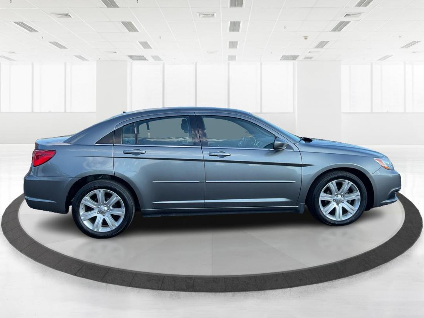 2013 Chrysler 200 Touring (1C3CCBBG0DN) with an 2.4L I-4 DOHC engine, located at 401 Woodman Dr, Riverside, OH, 45431, (937) 908-9800, 39.760899, -84.123421 - 2013 Chrysler 200 Touring - Photo#1