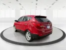 2013 Hyundai Tucson Limited (KM8JU3AC4DU) with an Theta II 2.4L I-4 DOHC engine, located at 1099 N County Rd 25A , Troy, OH, 45373, (937) 908-9800, 40.057079, -84.212883 - 2013 Hyundai Tucson Limited - Photo#4