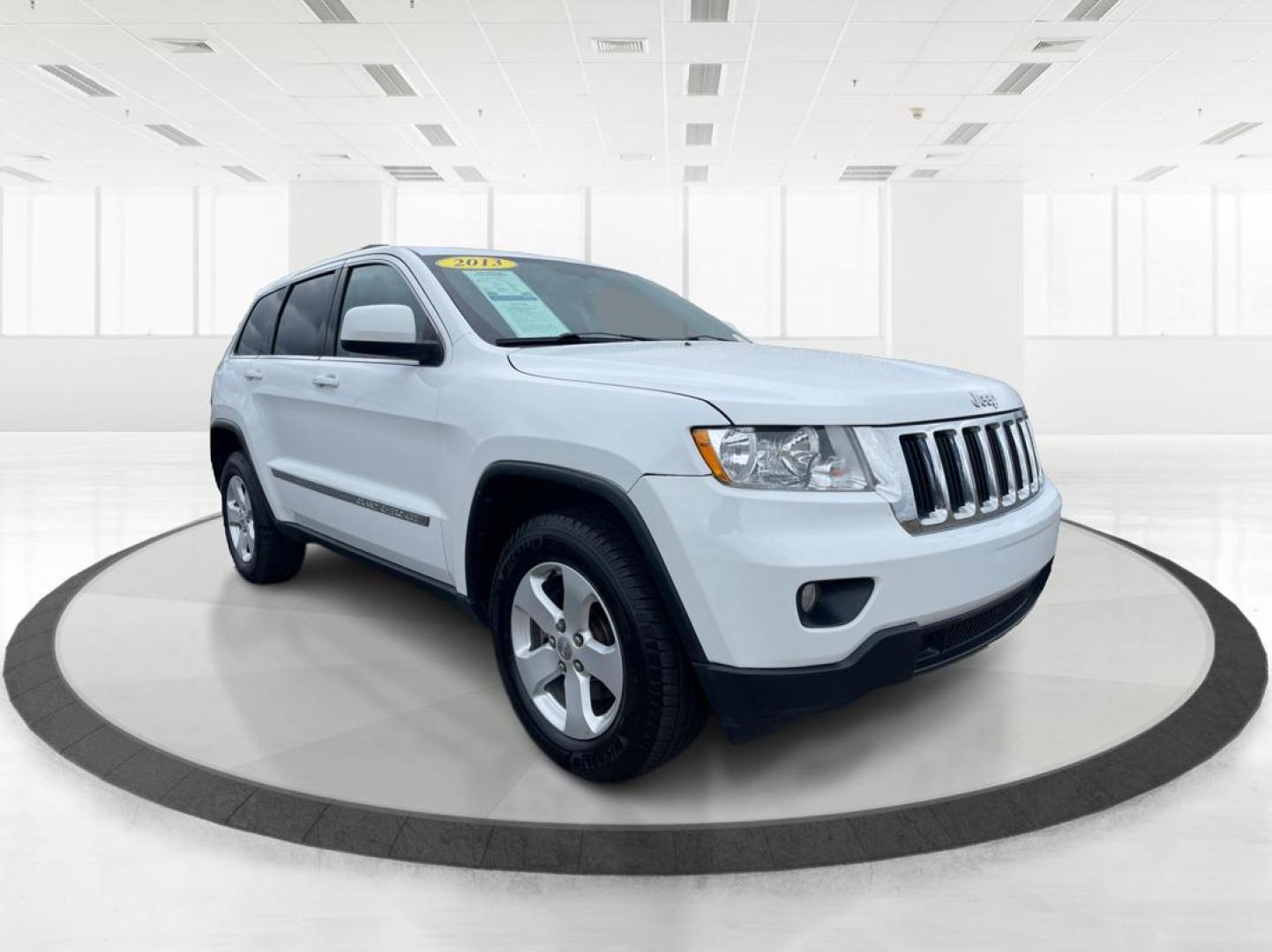 2013 Jeep Grand Cherokee Laredo (1C4RJFAG8DC) with an 3.6L V-6 DOHC engine, located at 880 E. National Road, Vandalia, OH, 45377, (937) 908-9800, 39.891918, -84.183594 - 2013 Jeep Grand Cherokee Laredo - Photo#0