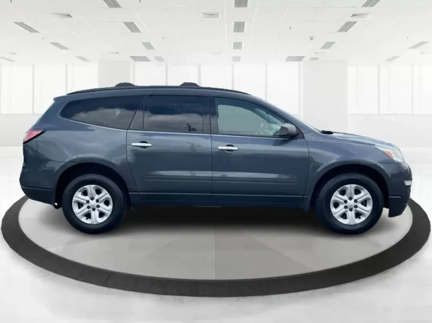 2014 Cyber Gray Metallic Chevrolet Traverse LS FWD w/PDC (1GNKRFED9EJ) with an 3.6L V6 DOHC 24V engine, 6-Speed Automatic transmission, located at 880 E. National Road, Vandalia, OH, 45377, (937) 908-9800, 39.891918, -84.183594 - 2014 Chevrolet Traverse LS FWD w/PDC - Photo#1