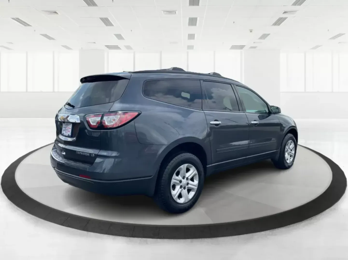 2014 Cyber Gray Metallic Chevrolet Traverse LS FWD w/PDC (1GNKRFED9EJ) with an 3.6L V6 DOHC 24V engine, 6-Speed Automatic transmission, located at 880 E. National Road, Vandalia, OH, 45377, (937) 908-9800, 39.891918, -84.183594 - 2014 Chevrolet Traverse LS FWD w/PDC - Photo#2