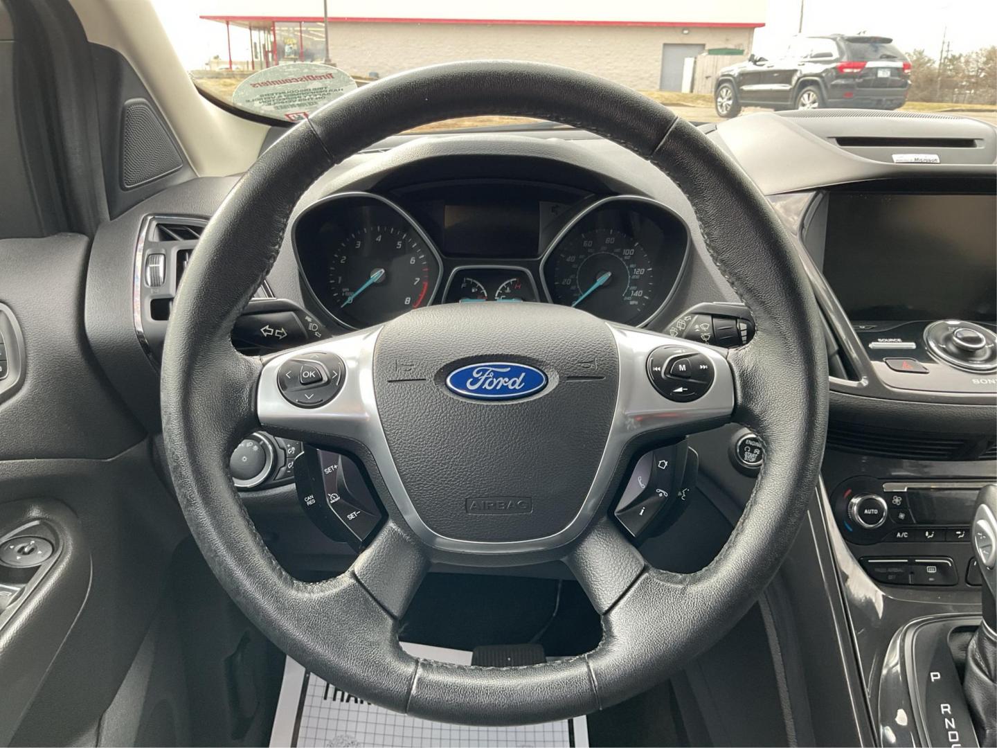 2014 Ford Escape Titanium (1FMCU9J95EU) with an EcoBoost 1.6L I-4 gasoline direct injection engine, located at 8750 N County Rd 25A, Piqua, OH, 45356, (937) 908-9800, 40.164391, -84.232513 - 2014 Ford Escape Titanium - Photo#15