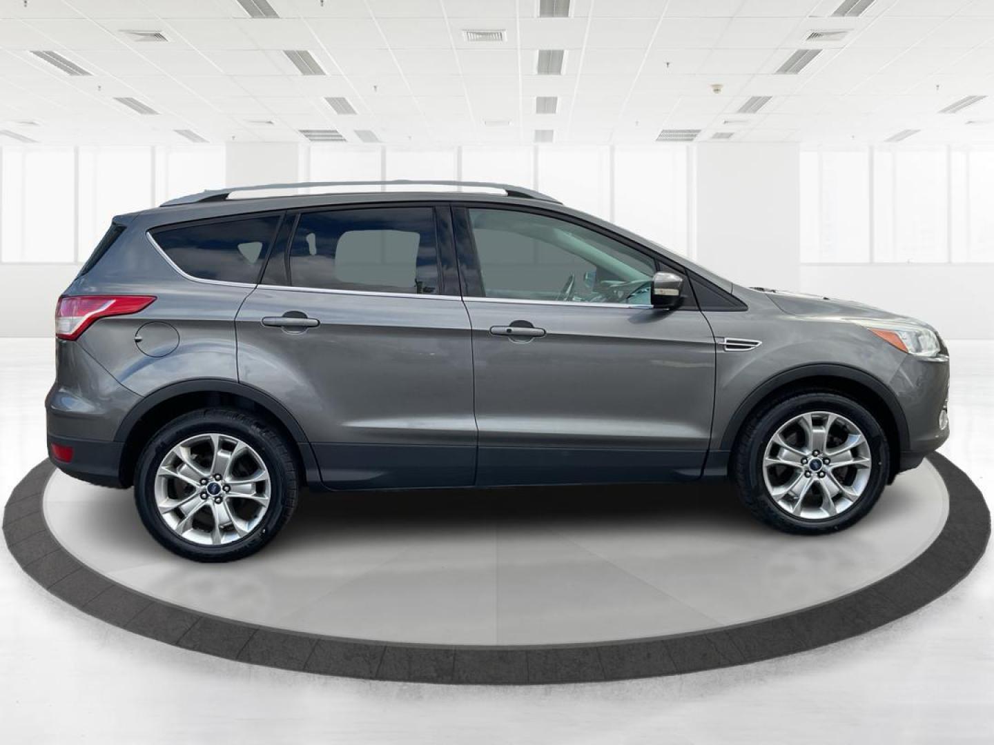 2014 Ford Escape Titanium (1FMCU9J95EU) with an EcoBoost 1.6L I-4 gasoline direct injection engine, located at 8750 N County Rd 25A, Piqua, OH, 45356, (937) 908-9800, 40.164391, -84.232513 - 2014 Ford Escape Titanium - Photo#1