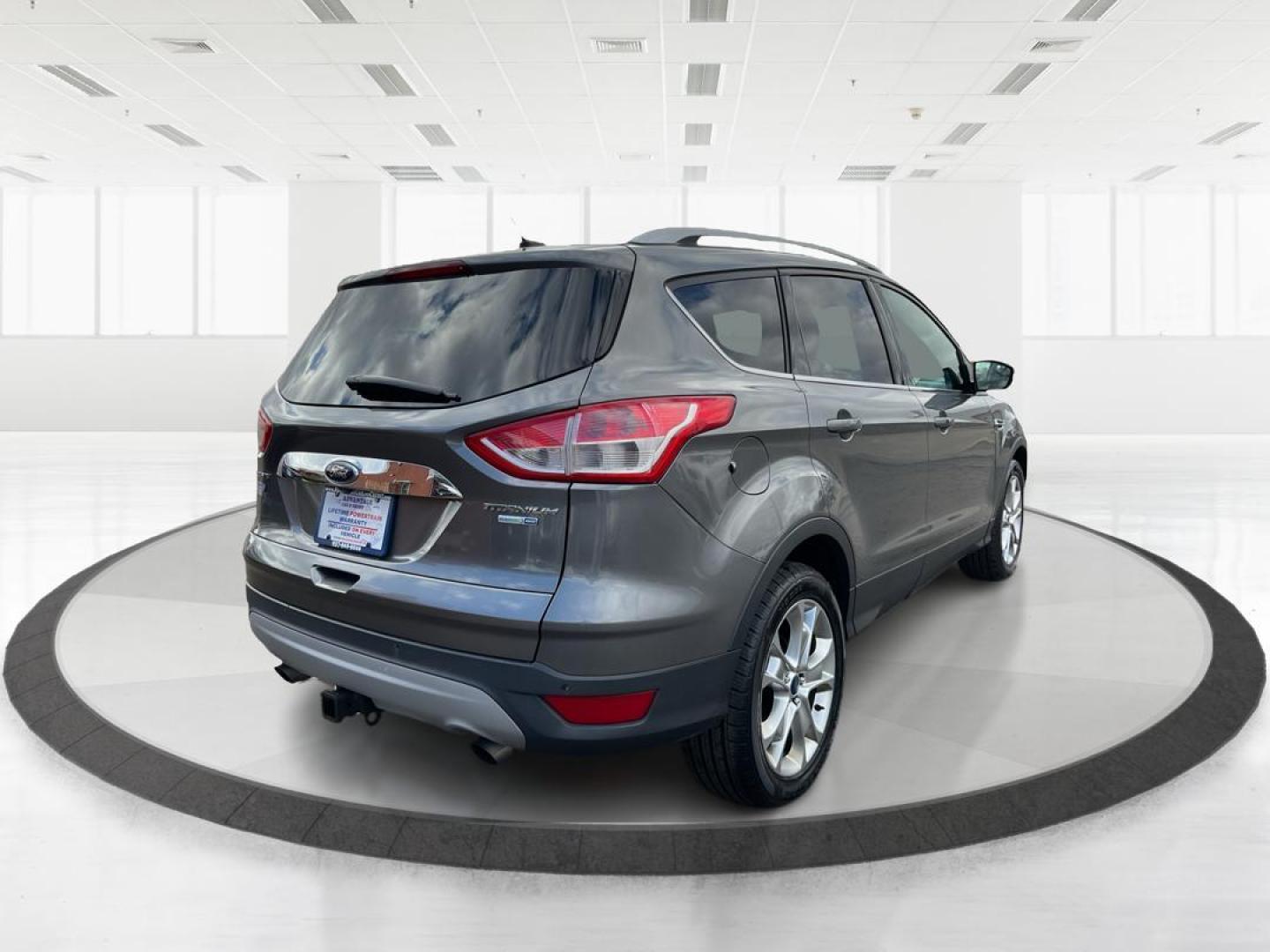 2014 Ford Escape Titanium (1FMCU9J95EU) with an EcoBoost 1.6L I-4 gasoline direct injection engine, located at 8750 N County Rd 25A, Piqua, OH, 45356, (937) 908-9800, 40.164391, -84.232513 - 2014 Ford Escape Titanium - Photo#2