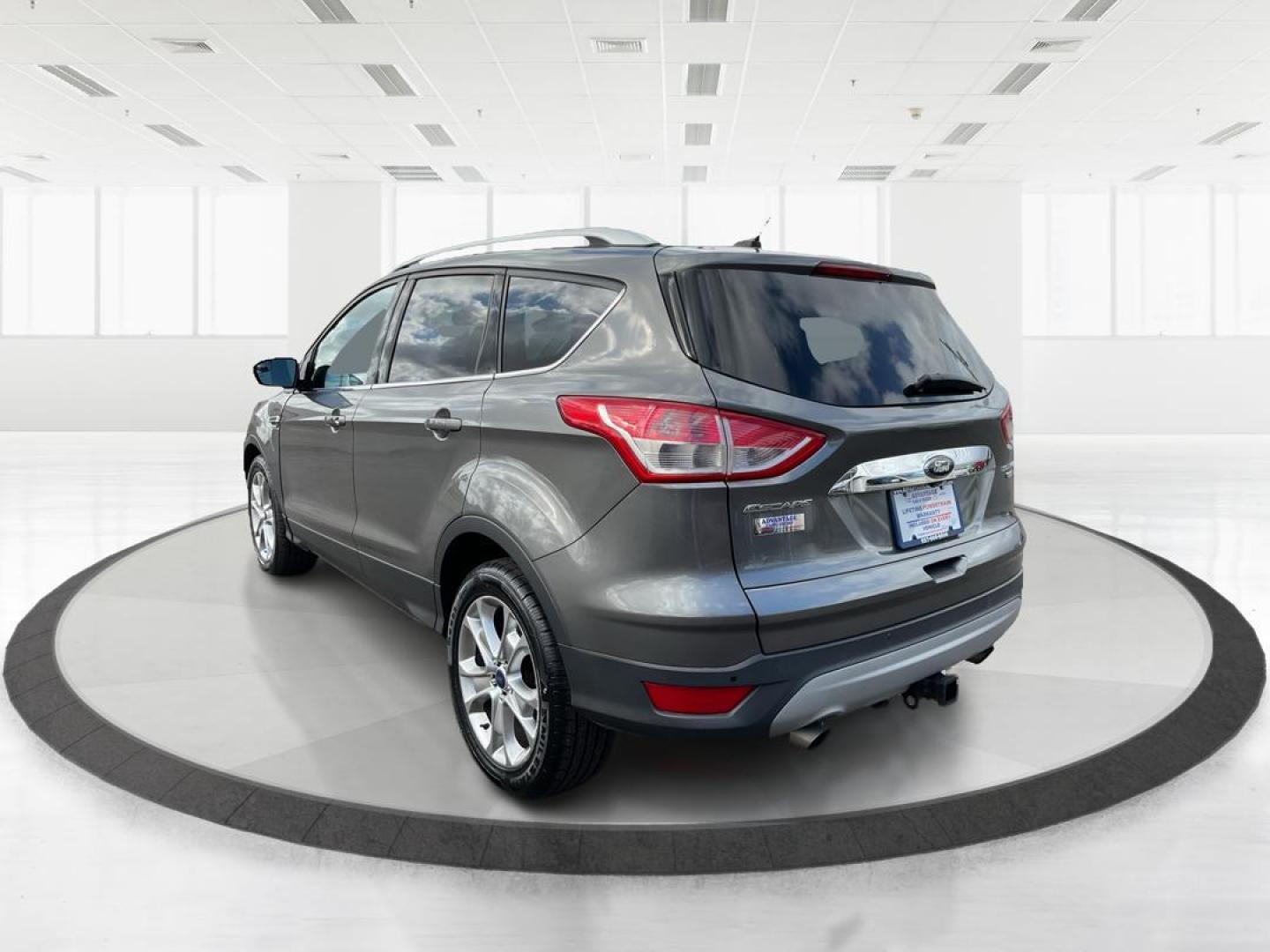 2014 Ford Escape Titanium (1FMCU9J95EU) with an EcoBoost 1.6L I-4 gasoline direct injection engine, located at 8750 N County Rd 25A, Piqua, OH, 45356, (937) 908-9800, 40.164391, -84.232513 - 2014 Ford Escape Titanium - Photo#4