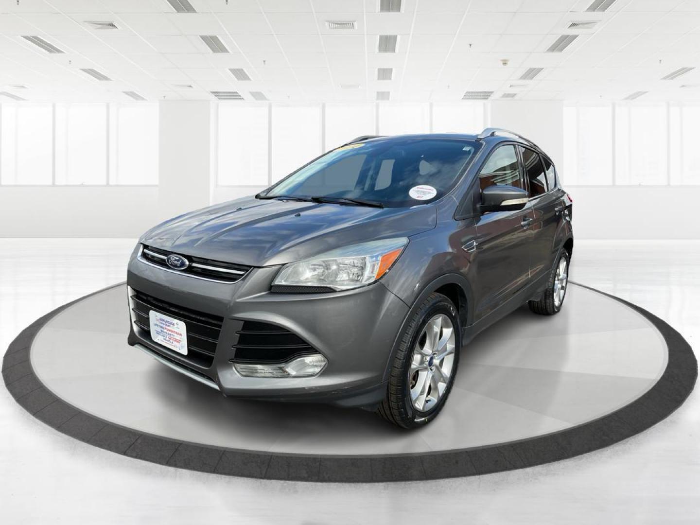 2014 Ford Escape Titanium (1FMCU9J95EU) with an EcoBoost 1.6L I-4 gasoline direct injection engine, located at 8750 N County Rd 25A, Piqua, OH, 45356, (937) 908-9800, 40.164391, -84.232513 - 2014 Ford Escape Titanium - Photo#7