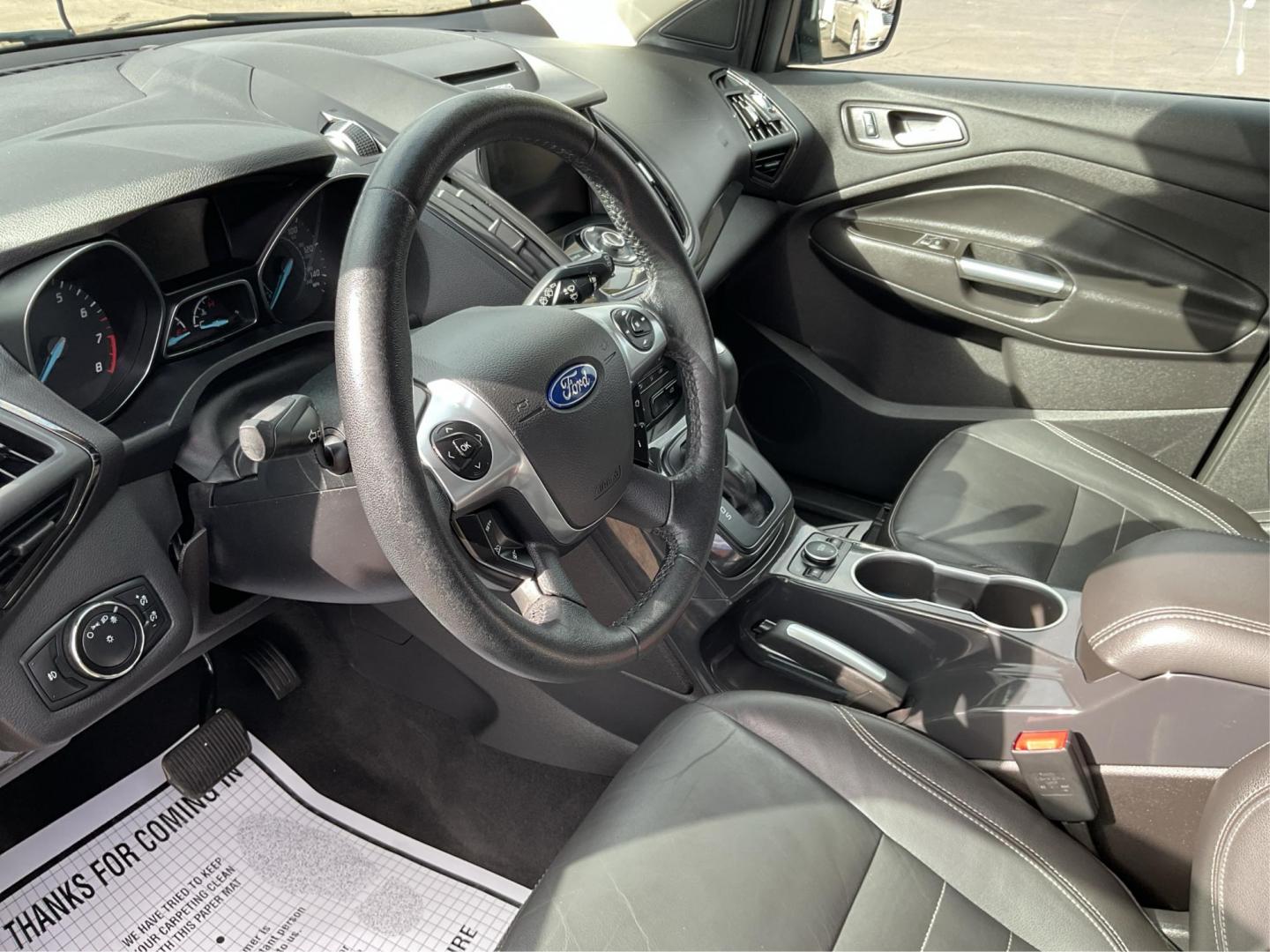 2014 Ford Escape Titanium (1FMCU9J95EU) with an EcoBoost 1.6L I-4 gasoline direct injection engine, located at 8750 N County Rd 25A, Piqua, OH, 45356, (937) 908-9800, 40.164391, -84.232513 - 2014 Ford Escape Titanium - Photo#8