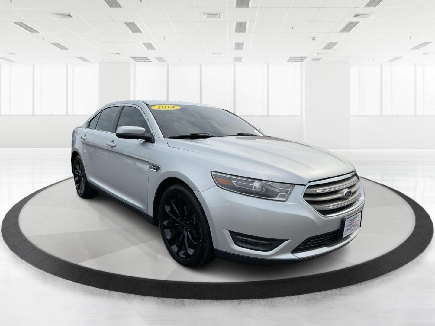 2014 Ford Taurus SEL (1FAHP2E86EG) with an EcoBoost 2L I-4 gasoline direct injection engine, located at 1099 N County Rd 25A , Troy, OH, 45373, (937) 908-9800, 40.057079, -84.212883 - 2014 Ford Taurus SEL - Photo#0