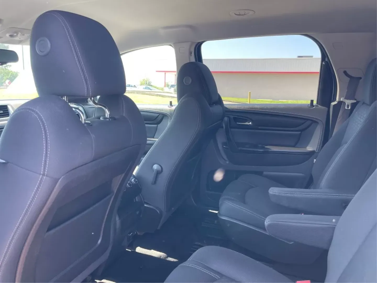 2014 GMC Acadia SLE-2 AWD (1GKKVPKD1EJ) with an 3.6L V6 DOHC 24V engine, 6-Speed Automatic transmission, located at 1099 N County Rd 25A , Troy, OH, 45373, (937) 908-9800, 40.057079, -84.212883 - If you're searching for the perfect family SUV that balances style, comfort, and an adventurous spirit, look no further than this stunning 2014 GMC Acadia SLE-2 AWD, now available at Advantage Car and Credit in Fairborn, OH. With spacious seating for up to eight passengers and the versatility needed - Photo#9