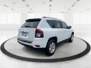 2014 Bright White Clearcoat Jeep Compass Sport FWD (1C4NJCBA9ED) with an 2.0L L4 DOHC 16V engine, located at 880 E. National Road, Vandalia, OH, 45377, (937) 908-9800, 39.891918, -84.183594 - 2014 Jeep Compass Sport FWD - Photo#2