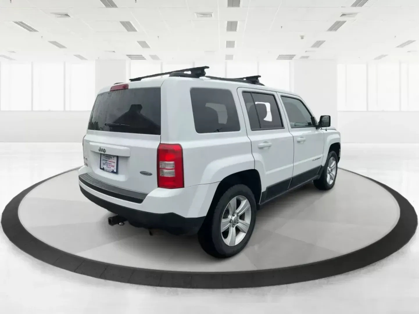 2014 Jeep Patriot Latitude (1C4NJRFB4ED) with an 2.4L I-4 DOHC engine, located at 1230 East Main St, Xenia, OH, 45385, (937) 908-9800, 39.688026, -83.910172 - 2014 Jeep Patriot Latitude - Photo#1