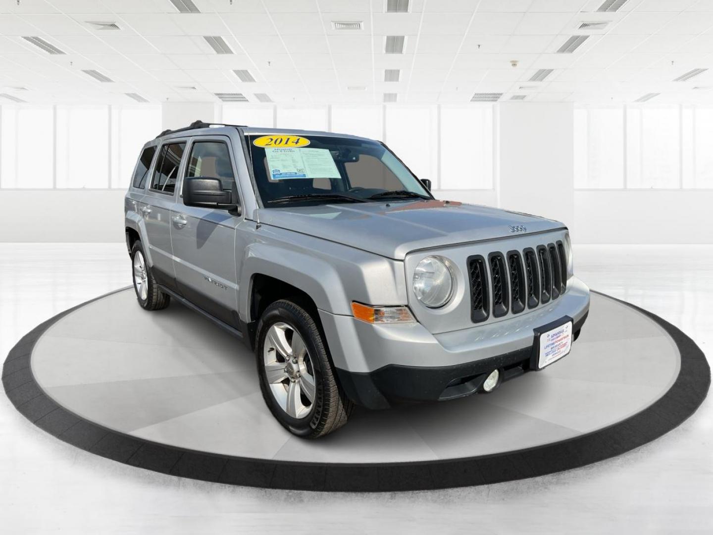 2014 Bright Silver Metallic CC Jeep Patriot Latitude 2WD (1C4NJPFA5ED) with an 2.0L L4 DOHC 16V engine, located at 880 E. National Road, Vandalia, OH, 45377, (937) 908-9800, 39.891918, -84.183594 - 2014 Jeep Patriot Latitude 2WD - Photo#0