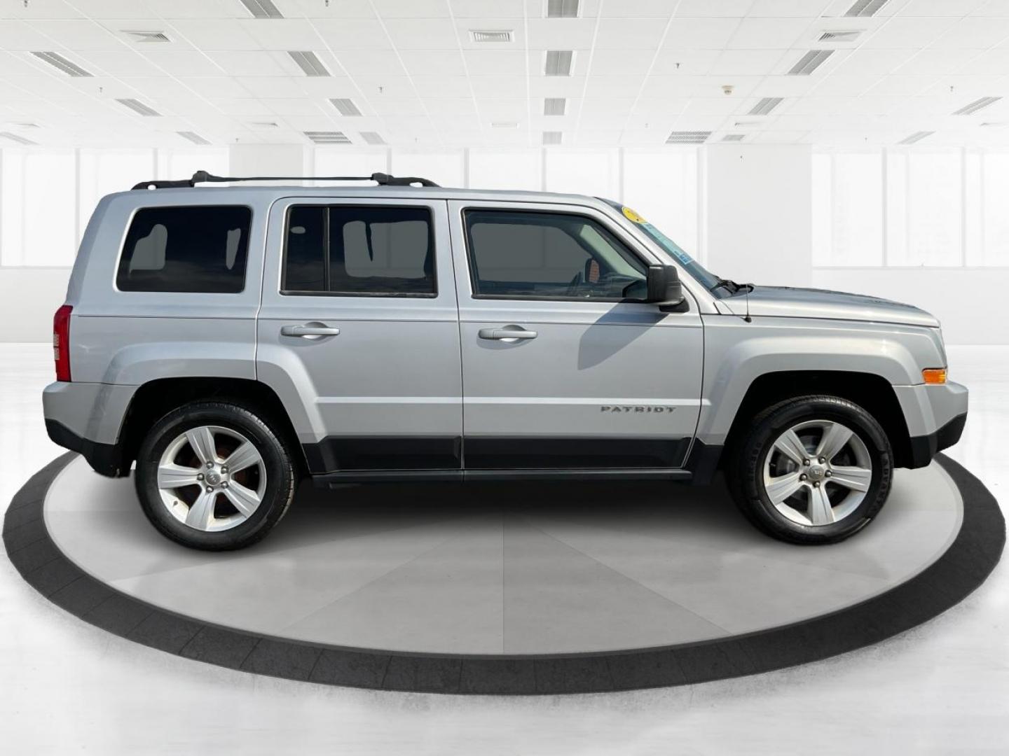 2014 Bright Silver Metallic CC Jeep Patriot Latitude 2WD (1C4NJPFA5ED) with an 2.0L L4 DOHC 16V engine, located at 880 E. National Road, Vandalia, OH, 45377, (937) 908-9800, 39.891918, -84.183594 - 2014 Jeep Patriot Latitude 2WD - Photo#1