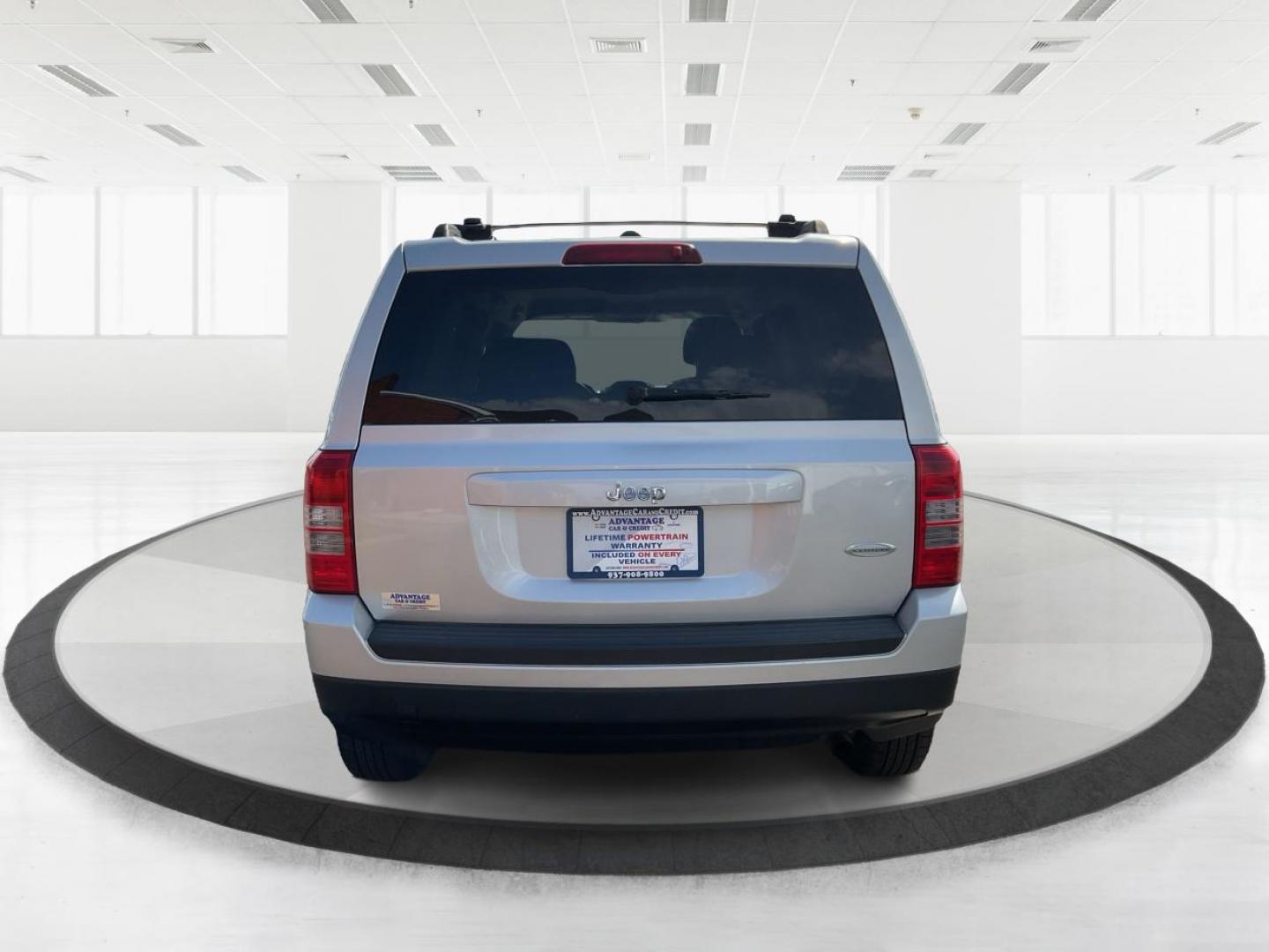 2014 Bright Silver Metallic CC Jeep Patriot Latitude 2WD (1C4NJPFA5ED) with an 2.0L L4 DOHC 16V engine, located at 880 E. National Road, Vandalia, OH, 45377, (937) 908-9800, 39.891918, -84.183594 - 2014 Jeep Patriot Latitude 2WD - Photo#2