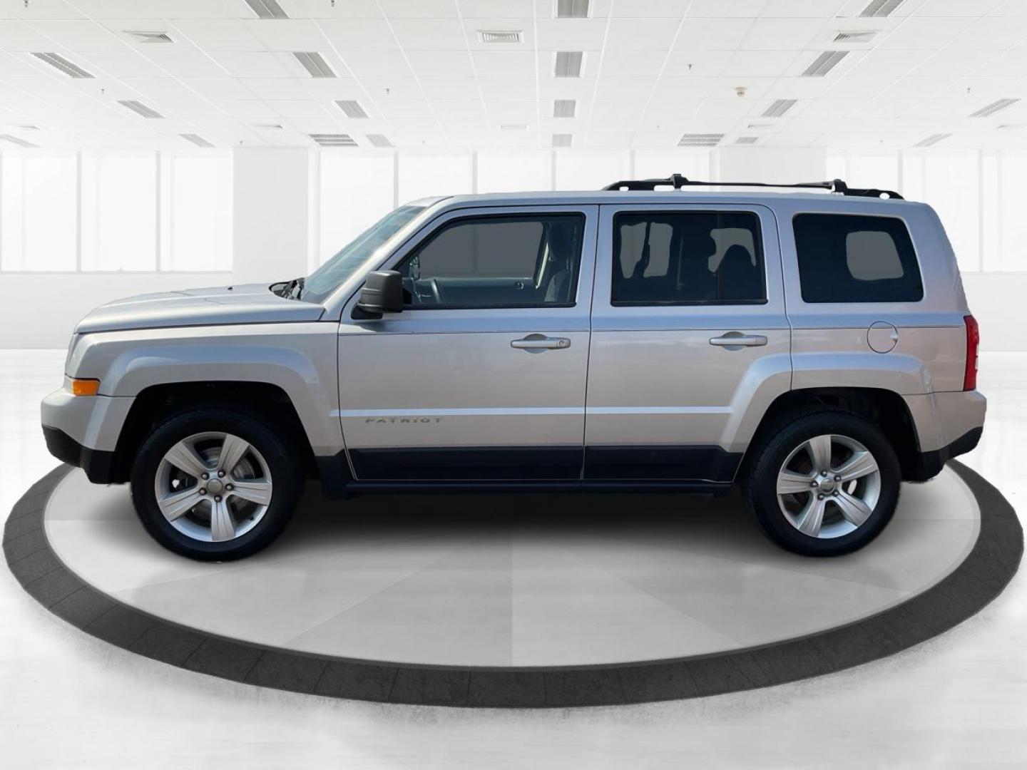 2014 Bright Silver Metallic CC Jeep Patriot Latitude 2WD (1C4NJPFA5ED) with an 2.0L L4 DOHC 16V engine, located at 880 E. National Road, Vandalia, OH, 45377, (937) 908-9800, 39.891918, -84.183594 - 2014 Jeep Patriot Latitude 2WD - Photo#3