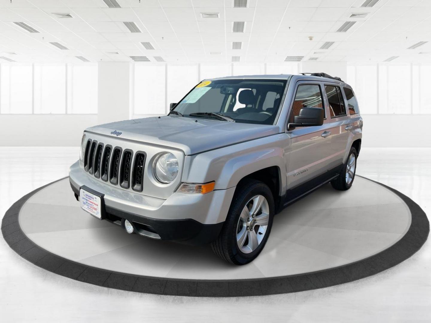 2014 Bright Silver Metallic CC Jeep Patriot Latitude 2WD (1C4NJPFA5ED) with an 2.0L L4 DOHC 16V engine, located at 880 E. National Road, Vandalia, OH, 45377, (937) 908-9800, 39.891918, -84.183594 - 2014 Jeep Patriot Latitude 2WD - Photo#5