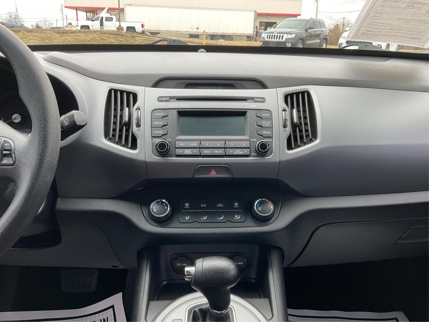 2015 Kia Sportage LX FWD (KNDPB3AC3F7) with an 2.4L V6 DOHC 24V engine, 6-Speed Automatic transmission, located at 1099 N County Rd 25A , Troy, OH, 45373, (937) 908-9800, 40.057079, -84.212883 - 2015 Kia Sportage LX FWD - Photo#12