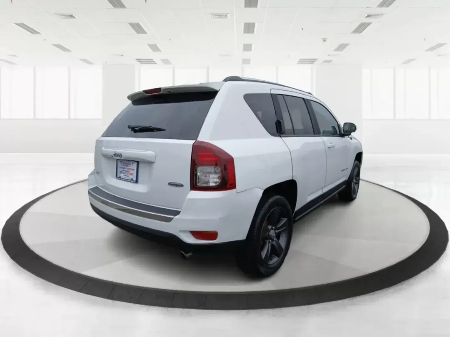 2016 Jeep Compass Latitude FWD (1C4NJCEA3GD) with an 2.0L L4 DOHC 16V engine, Continuously Variable Transmission transmission, located at 880 E. National Road, Vandalia, OH, 45377, (937) 908-9800, 39.891918, -84.183594 - 2016 Jeep Compass Latitude FWD - Photo#2