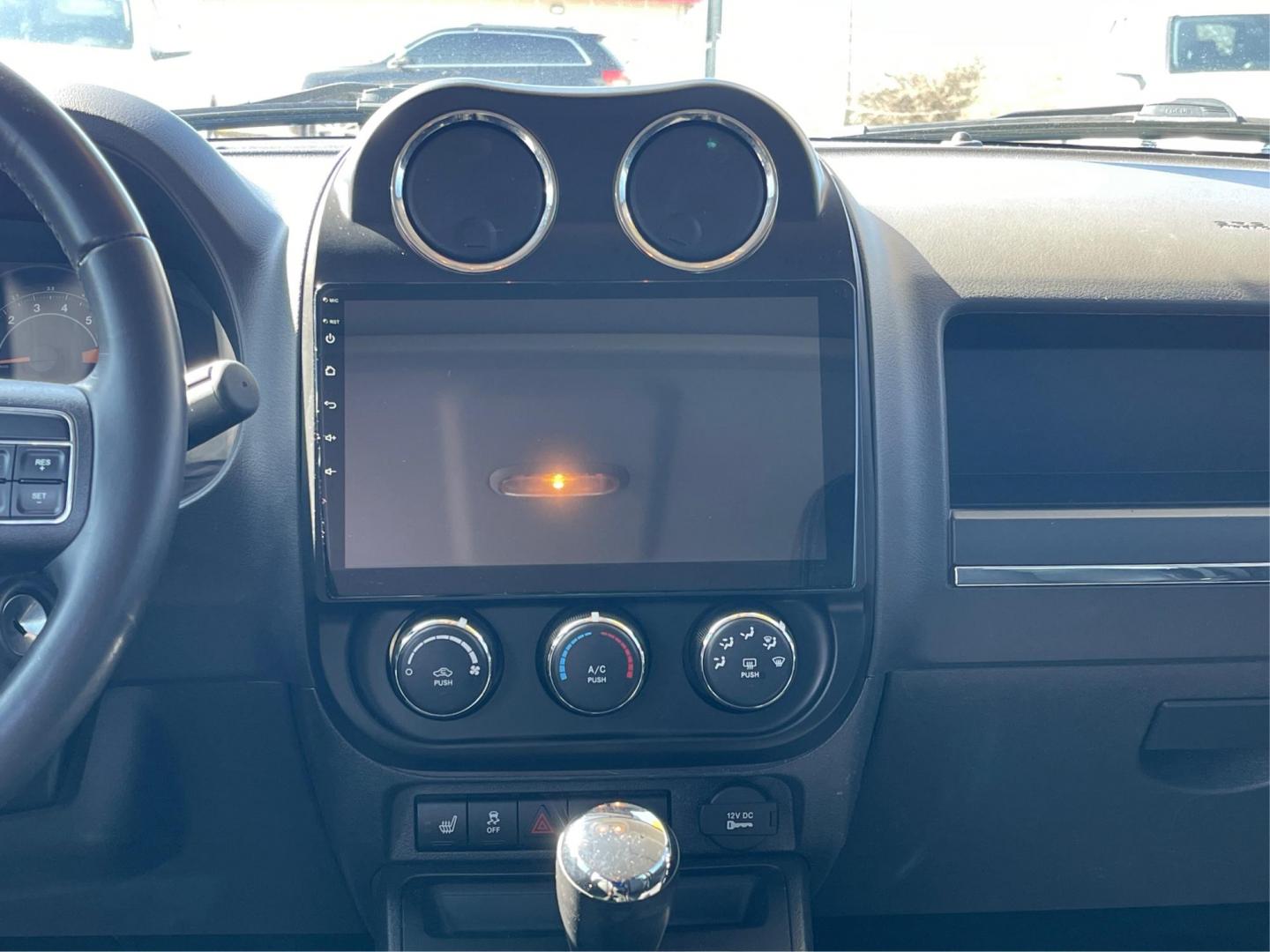 2016 Jeep Patriot High Altitude Edition (1C4NJPFAXGD) with an 2L I-4 DOHC engine, located at 8750 N County Rd 25A, Piqua, OH, 45356, (937) 908-9800, 40.164391, -84.232513 - 2016 Jeep Patriot High Altitude Edition - Photo#12