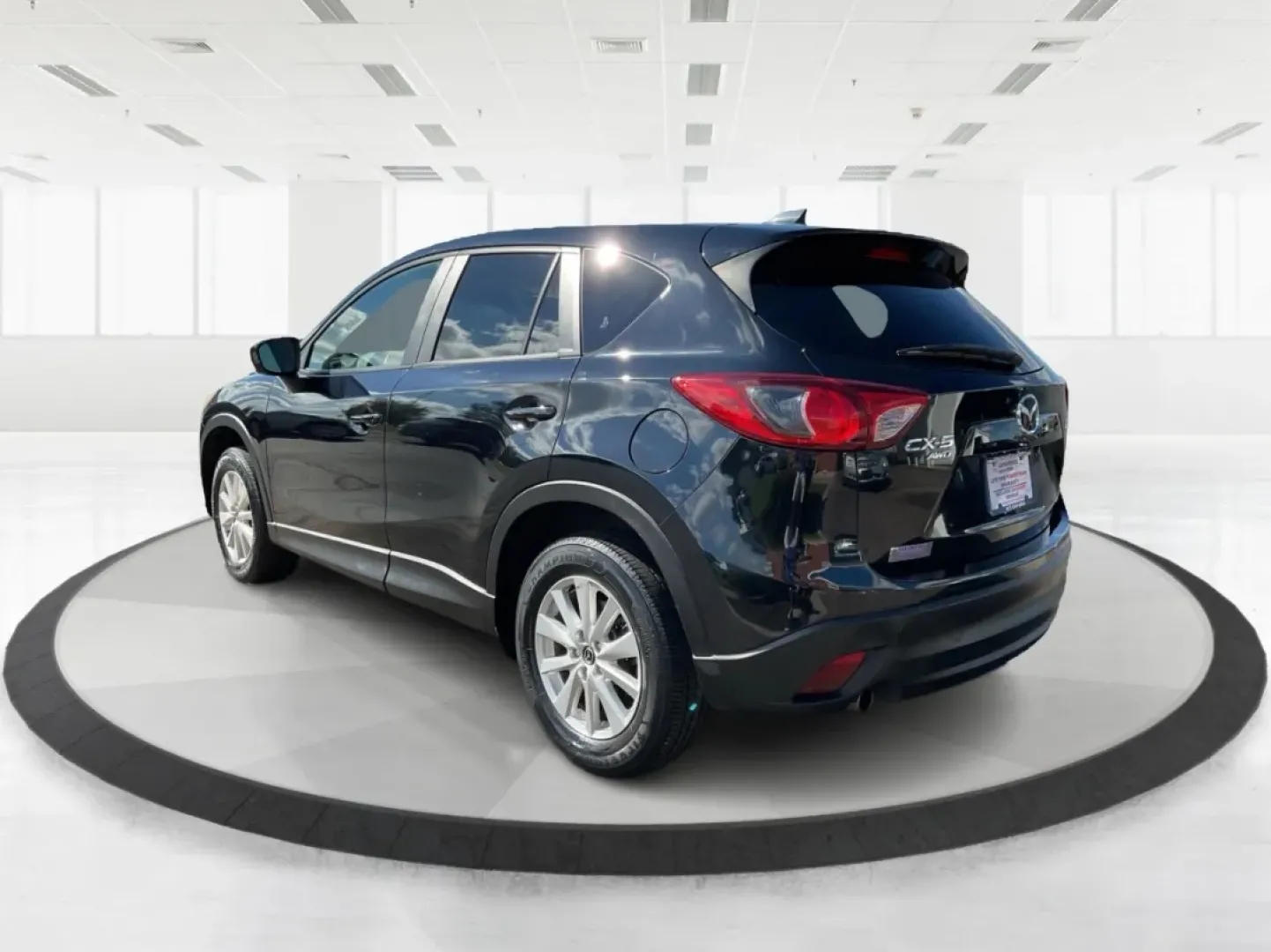 2014 Jet Black Mica Mazda CX-5 Touring AWD (JM3KE4CY2E0) with an 2.5L L4 DOHC 16V engine, 6-Speed Automatic transmission, located at 1099 N County Rd 25A , Troy, OH, 45373, (937) 908-9800, 40.057079, -84.212883 - **Explore the Open Road in the 2014 Mazda CX-5 Touring AWD from Advantage Car and Credit - Troy!**<br /> <br /> Are you ready to elevate your driving experience? Whether you're a growing family seeking a reliable SUV for weekend adventures, a commuter looking for comfort on long drives, or a budget- - Photo#4