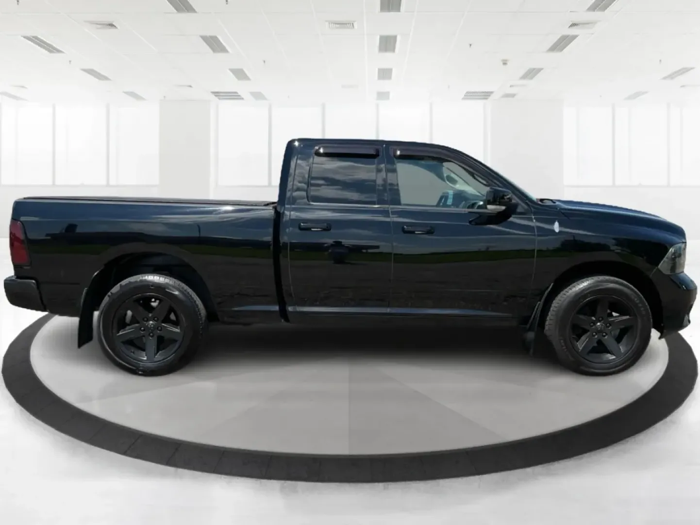 2012 Black Ram 1500 Sport Quad Cab 4WD (1C6RD7HT2CS) with an 5.7L V8 OHV 16V engine, 6-Speed Automatic transmission, located at 1230 East Main St, Xenia, OH, 45385, (937) 908-9800, 39.688026, -83.910172 - 2012 Ram 1500 Sport Quad Cab 4WD - Photo#1