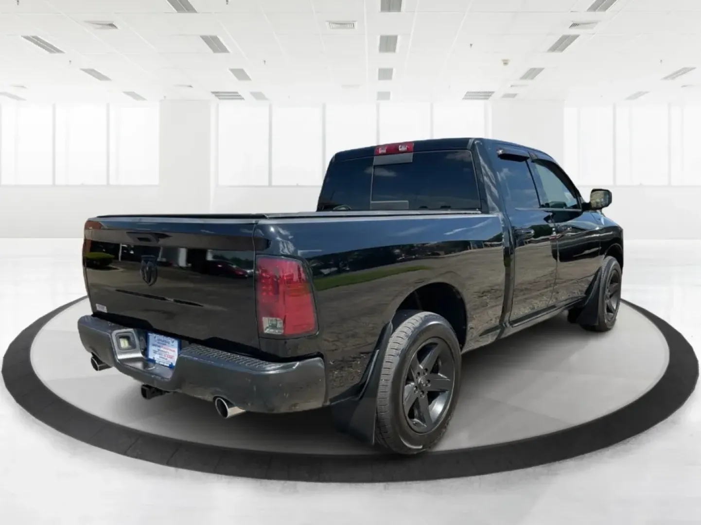2012 Black Ram 1500 Sport Quad Cab 4WD (1C6RD7HT2CS) with an 5.7L V8 OHV 16V engine, 6-Speed Automatic transmission, located at 1230 East Main St, Xenia, OH, 45385, (937) 908-9800, 39.688026, -83.910172 - 2012 Ram 1500 Sport Quad Cab 4WD - Photo#2
