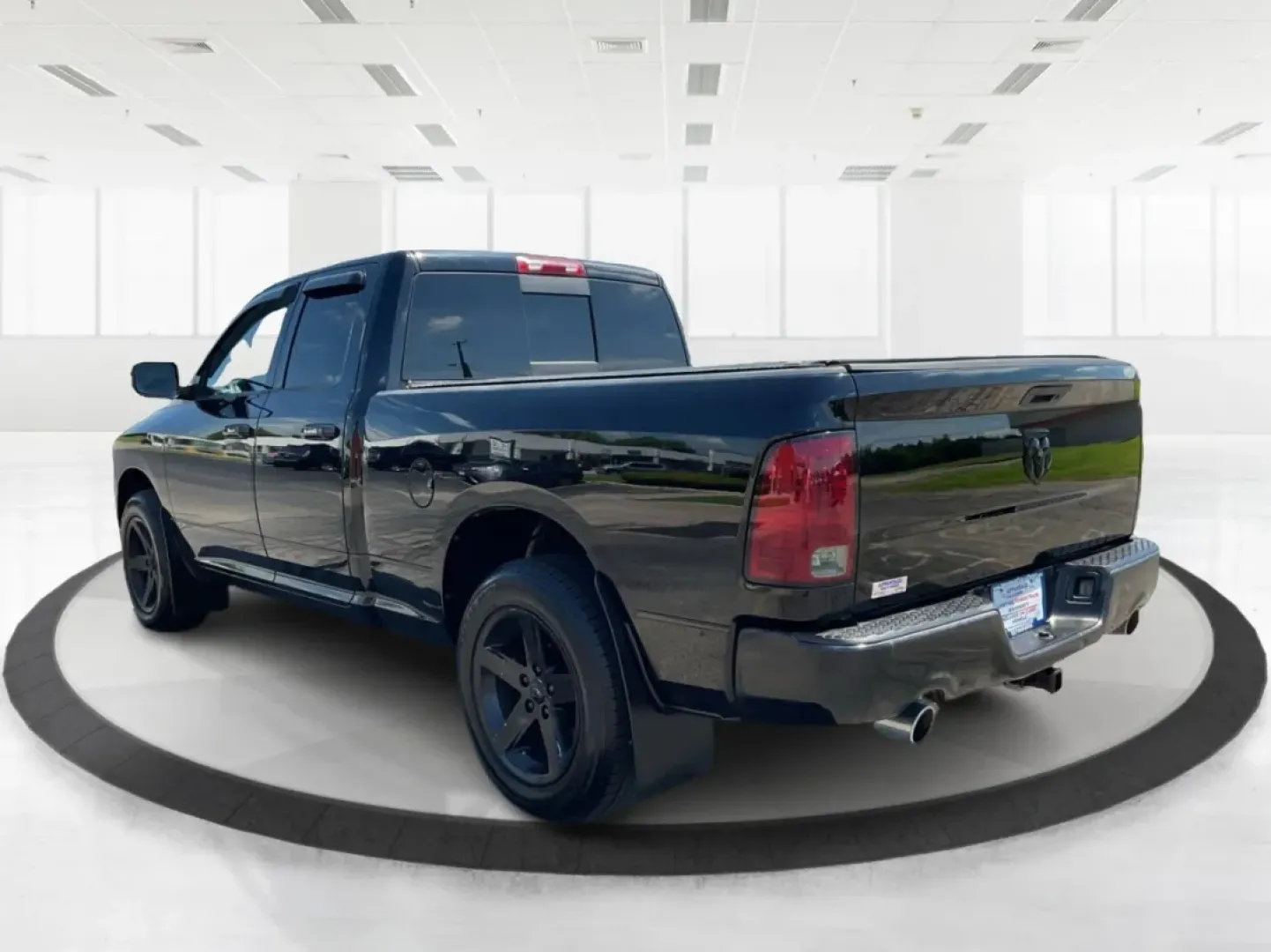 2012 Black Ram 1500 Sport Quad Cab 4WD (1C6RD7HT2CS) with an 5.7L V8 OHV 16V engine, 6-Speed Automatic transmission, located at 1230 East Main St, Xenia, OH, 45385, (937) 908-9800, 39.688026, -83.910172 - 2012 Ram 1500 Sport Quad Cab 4WD - Photo#4