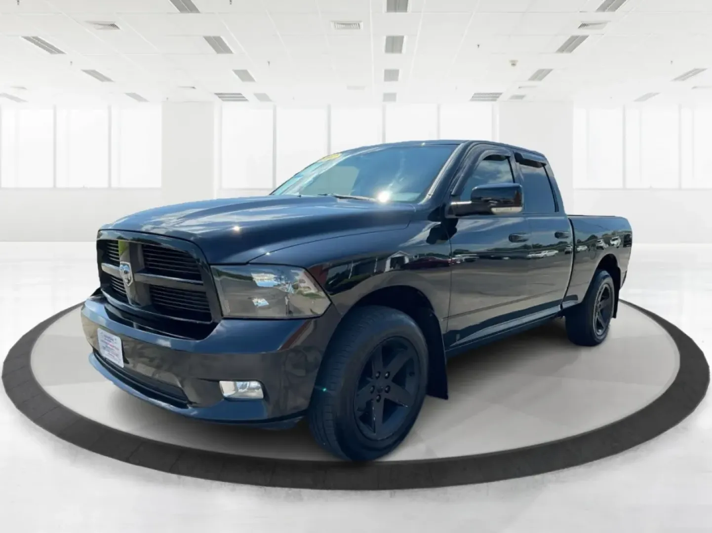 2012 Black Ram 1500 Sport Quad Cab 4WD (1C6RD7HT2CS) with an 5.7L V8 OHV 16V engine, 6-Speed Automatic transmission, located at 1230 East Main St, Xenia, OH, 45385, (937) 908-9800, 39.688026, -83.910172 - 2012 Ram 1500 Sport Quad Cab 4WD - Photo#8