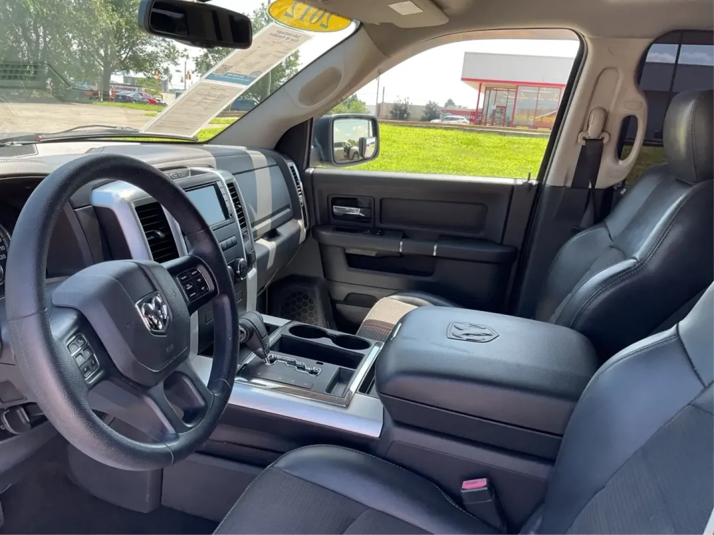 2012 Black Ram 1500 Sport Quad Cab 4WD (1C6RD7HT2CS) with an 5.7L V8 OHV 16V engine, 6-Speed Automatic transmission, located at 1230 East Main St, Xenia, OH, 45385, (937) 908-9800, 39.688026, -83.910172 - 2012 Ram 1500 Sport Quad Cab 4WD - Photo#9