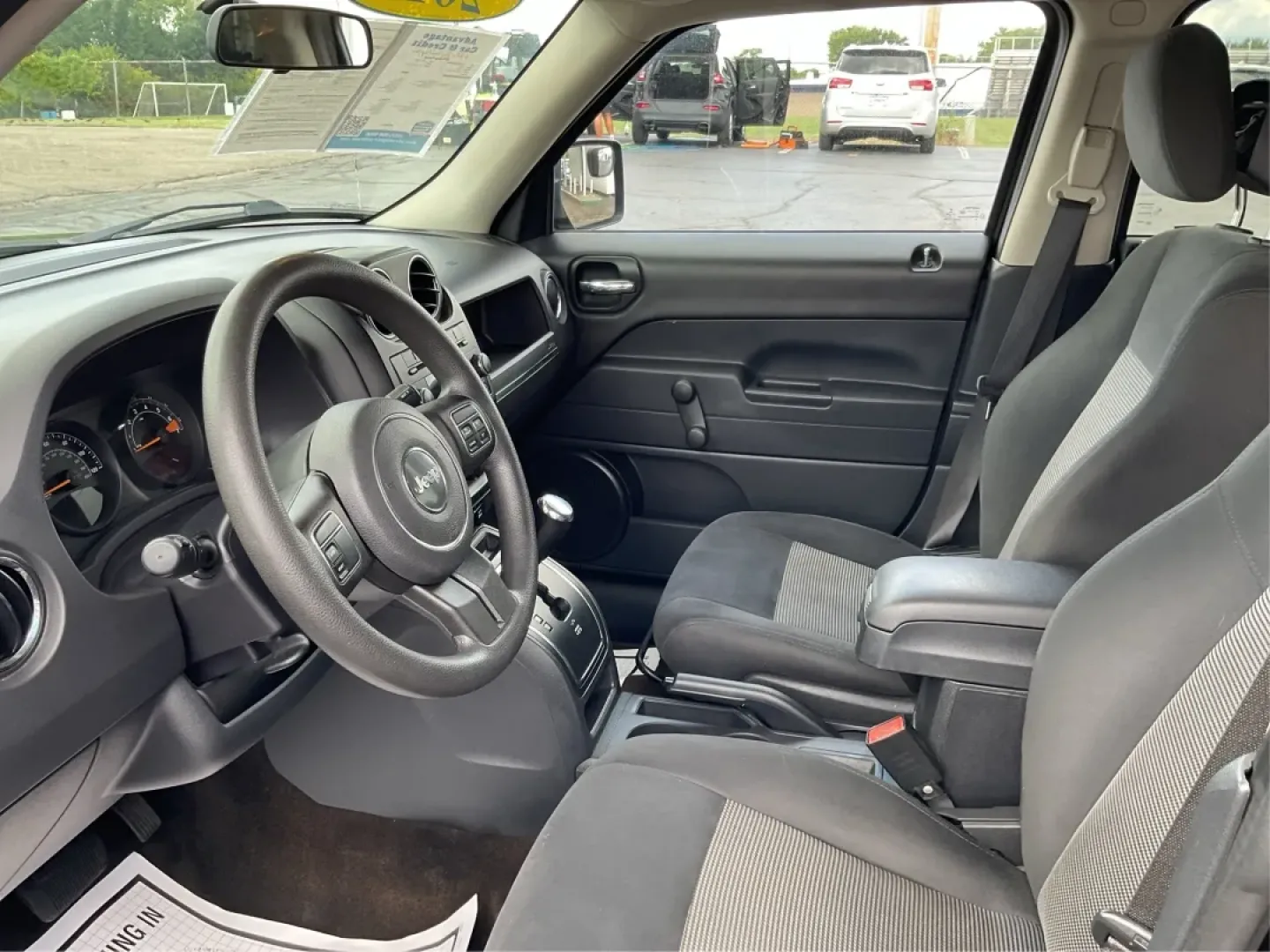2015 Black Clearcoat Jeep Patriot Sport 2WD (1C4NJPBA6FD) with an 2.0L L4 DOHC 16V engine, located at 1099 N County Rd 25A , Troy, OH, 45373, (937) 908-9800, 40.057079, -84.212883 - **Adventure Awaits in the 2015 Jeep Patriot Your Perfect Companion for Weekend Getaways!**<br /> <br /> Imagine hitting the open road with the wind in your hair, the sound of your favorite playlist filling the cabin, and the freedom to explore every hidden gem along the way. The 2015 Jeep Patriot i - Photo#9