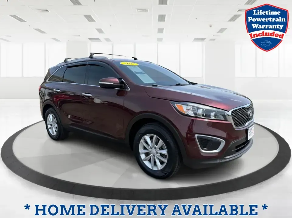 2017 Burgundy Kia Sorento L 2WD (5XYPG4A31HG) with an 2.4L L4 DOHC 16V engine, 6-Speed Automatic transmission, located at 4508 South Dixie Dr, Moraine, OH, 45439, (937) 908-9800, 39.689976, -84.218452 - Pack up the kids, load the groceries, and still have room for a spontaneous weekend escape to Carillon Historical Park or a day exploring Cox Arboretum-this 2017 Kia Sorento L 2WD is the kind of practical SUV that fits real Moraine and Dayton-area life. With three-row versatility in a midsize footpr - Photo#0