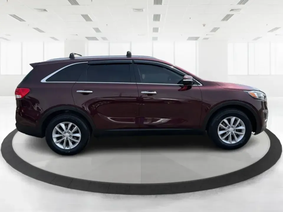 2017 Burgundy Kia Sorento L 2WD (5XYPG4A31HG) with an 2.4L L4 DOHC 16V engine, 6-Speed Automatic transmission, located at 4508 South Dixie Dr, Moraine, OH, 45439, (937) 908-9800, 39.689976, -84.218452 - Pack up the kids, load the groceries, and still have room for a spontaneous weekend escape to Carillon Historical Park or a day exploring Cox Arboretum-this 2017 Kia Sorento L 2WD is the kind of practical SUV that fits real Moraine and Dayton-area life. With three-row versatility in a midsize footpr - Photo#1