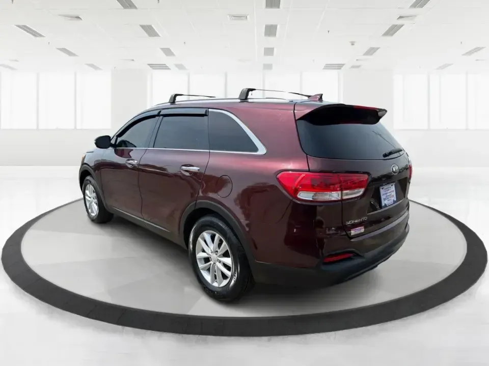2017 Burgundy Kia Sorento L 2WD (5XYPG4A31HG) with an 2.4L L4 DOHC 16V engine, 6-Speed Automatic transmission, located at 4508 South Dixie Dr, Moraine, OH, 45439, (937) 908-9800, 39.689976, -84.218452 - Pack up the kids, load the groceries, and still have room for a spontaneous weekend escape to Carillon Historical Park or a day exploring Cox Arboretum-this 2017 Kia Sorento L 2WD is the kind of practical SUV that fits real Moraine and Dayton-area life. With three-row versatility in a midsize footpr - Photo#4