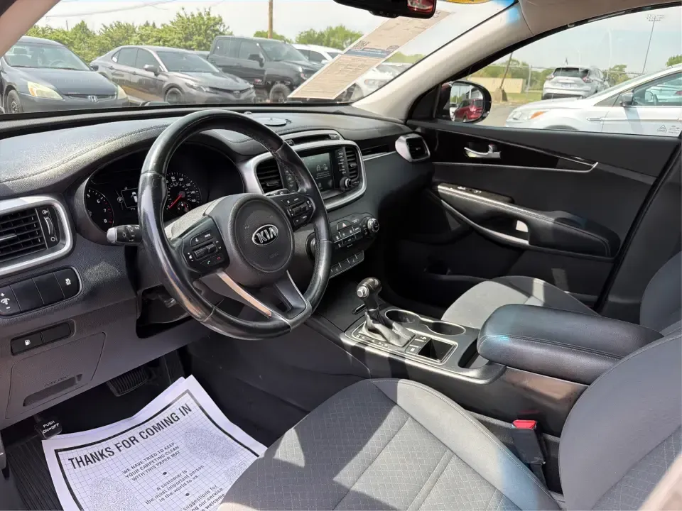 2017 Burgundy Kia Sorento L 2WD (5XYPG4A31HG) with an 2.4L L4 DOHC 16V engine, 6-Speed Automatic transmission, located at 4508 South Dixie Dr, Moraine, OH, 45439, (937) 908-9800, 39.689976, -84.218452 - Pack up the kids, load the groceries, and still have room for a spontaneous weekend escape to Carillon Historical Park or a day exploring Cox Arboretum-this 2017 Kia Sorento L 2WD is the kind of practical SUV that fits real Moraine and Dayton-area life. With three-row versatility in a midsize footpr - Photo#9